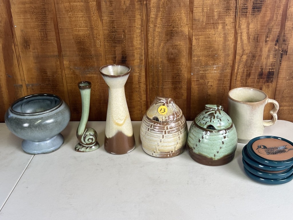 Frankoma smalls grouping: goose coastes, honey pots, etc. Dimensions: Honey Pot: H 5.5" x W 4" Condition: Some crazing to blue, sticker residue to coaster.