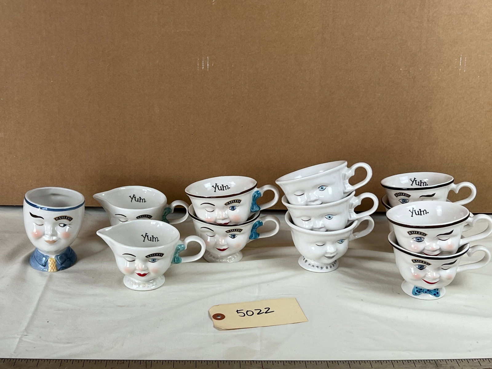 Baileys Irish Cream Yum mugs/ teacups, etc: Grouping of 12 pieces including various designs. Used, no chips.