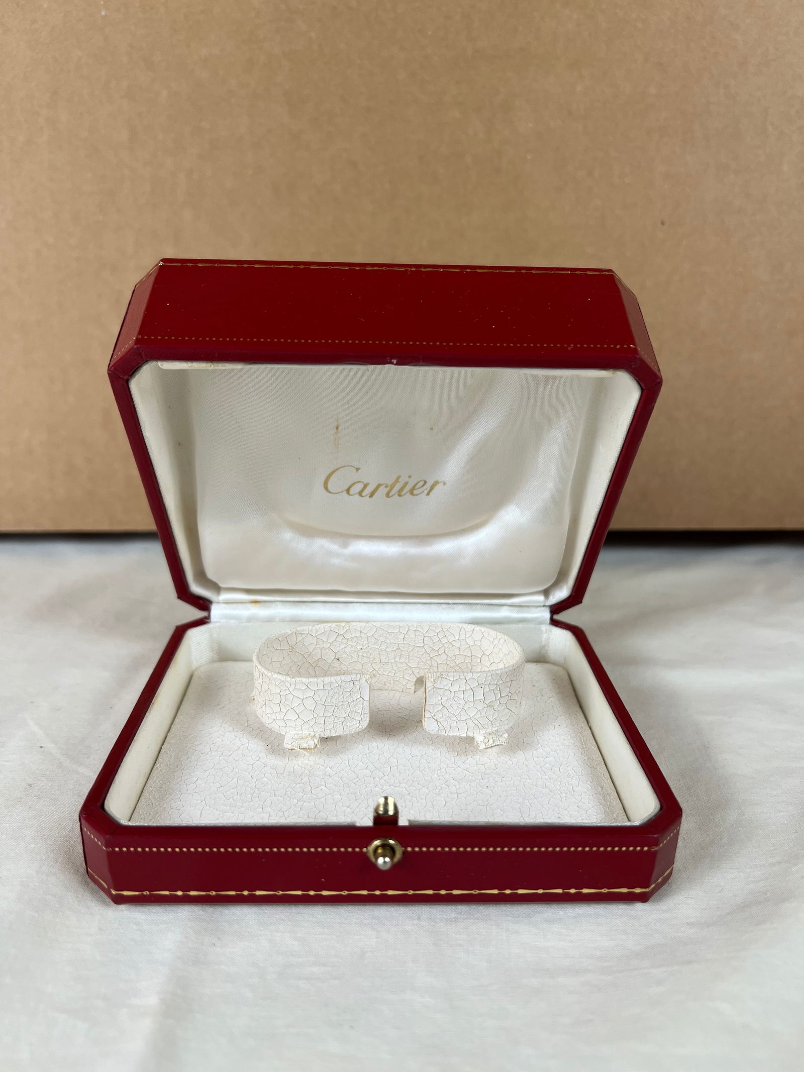 Cartier leather watch box: Dimensions: 4.75" x W 4" Some crackling to leather interior, signs of use.