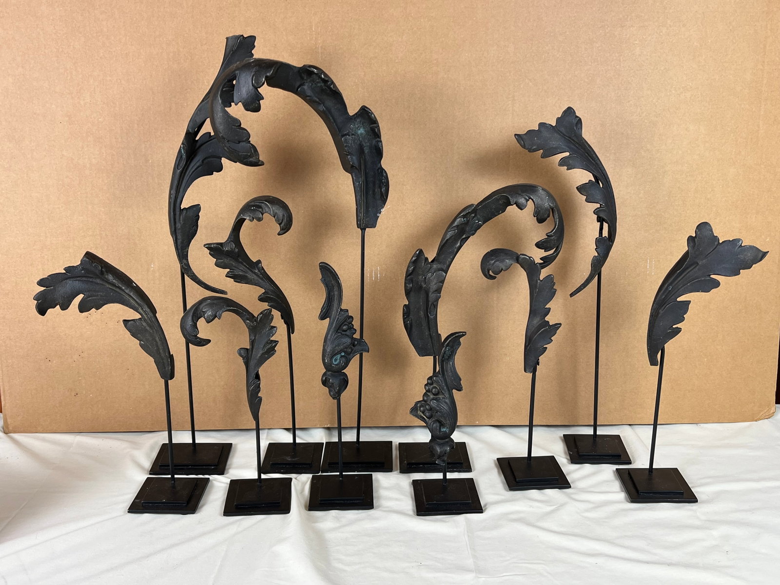 (11) Restoration Hardware Acanthus Leaf on stands: Stading decor, metal. Dimensions: Largest: H 223" x W 9" One with damage to top, barely noticeable.
