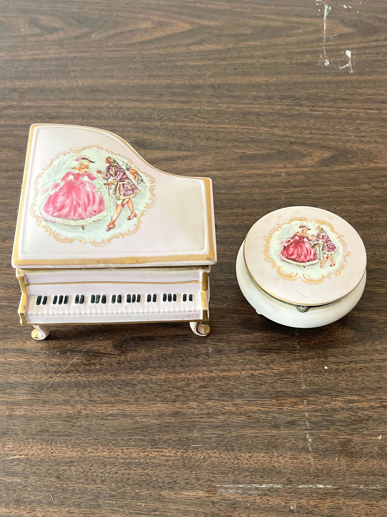Vintage porcelain dresser set- Music box- French: Likely French, numbered under. Piano music box for jewelry and lidded powder jar. Dimensions: Piano: L 6" x H 4" Condition: Dirty, working. Music box plays somewhere my love.
