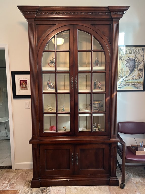 8' Tall Curio Cabinet: Solid wood, handmade, quality maker like Hooker or similiar. Antiqued paint to interior. Dimensions: H 8' x W 50" x D 17" Presenting nicely, only minor signs of use. Low Estimate: 400.00 High Estimat