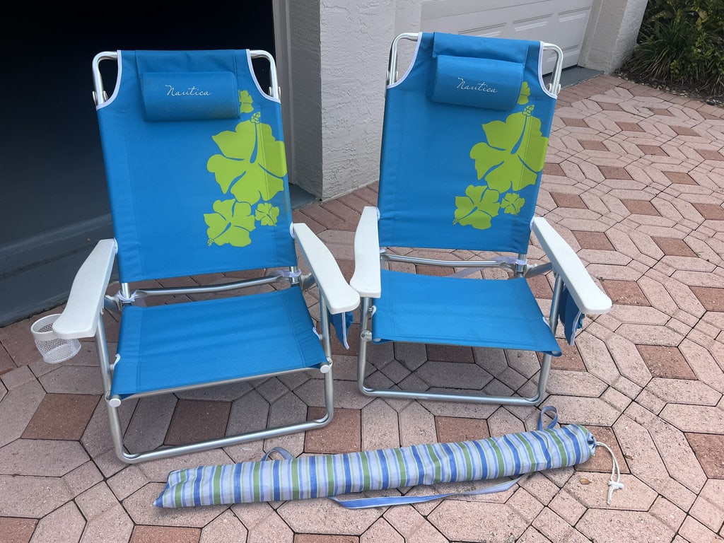 (2) Beach Chairs and Umbrella: Nautica Chairs and small umbrella. All used and showing signs of use, life left! Low Estimate: 10.00 High Estimate: 100.00