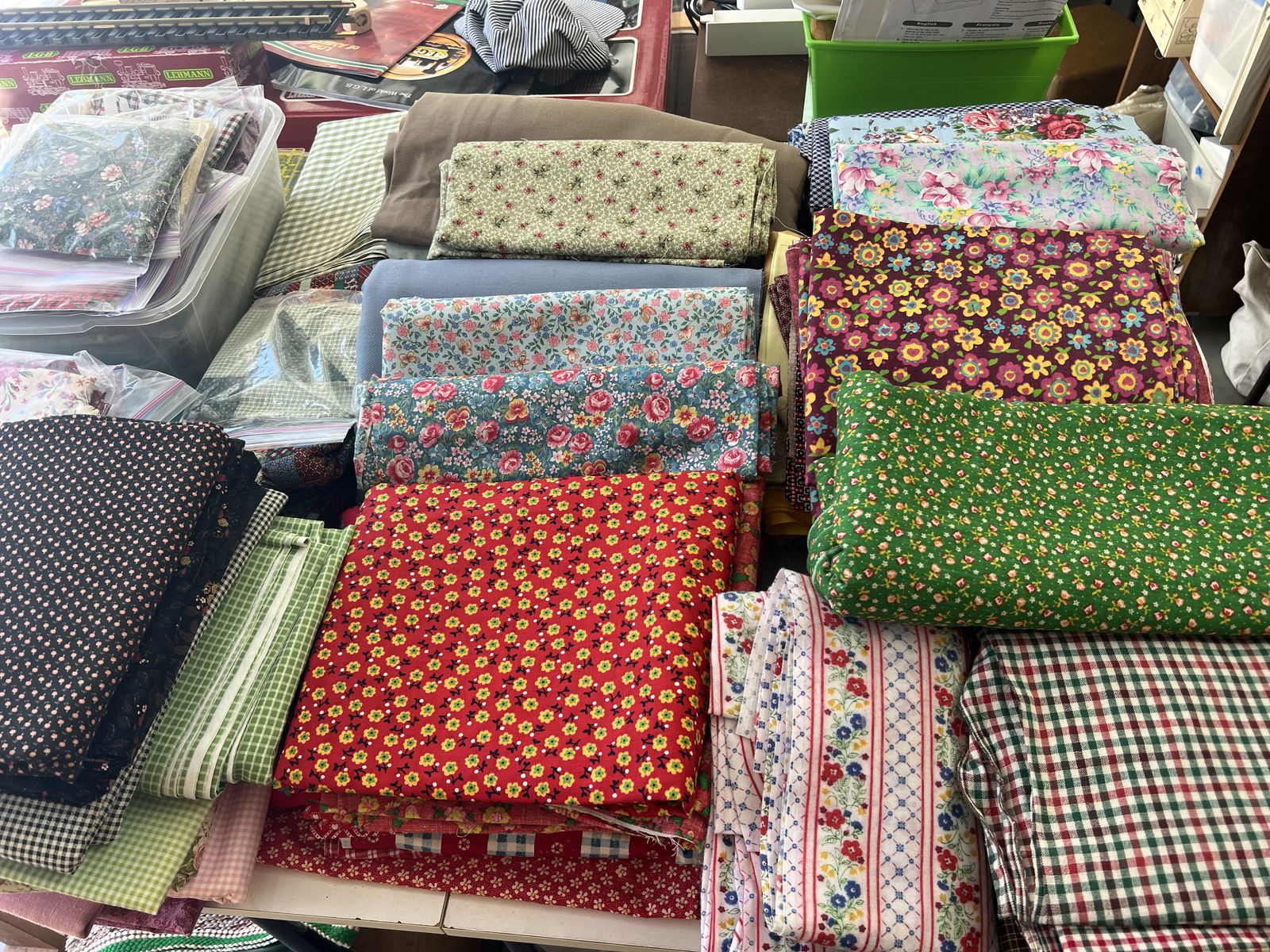 Vintage Quilting Fabric: Precut quilting squares, yards of vintage cotton fabric and more! Checkout the next lot for the associated cutting mats! Condition: Well cared for. Low Estimate: 10.00 High Estimate: 1000.00
