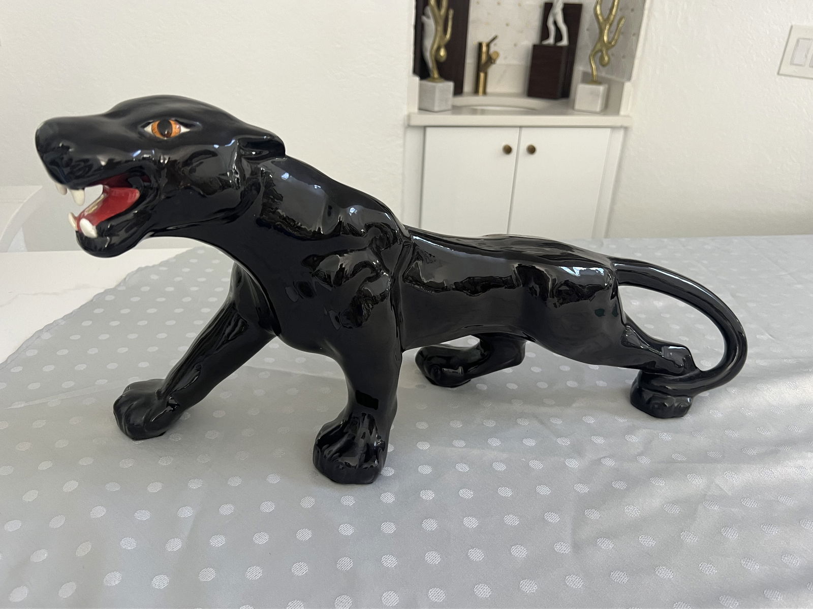 Mid Century Ceramic Puma or Black Panther: In the style of Royal Haeger, large size. Dimensions: L 22" x W 7" x H 11" Condition: No issues to note. Low Estimate: 150.00High Estimate: 200.00