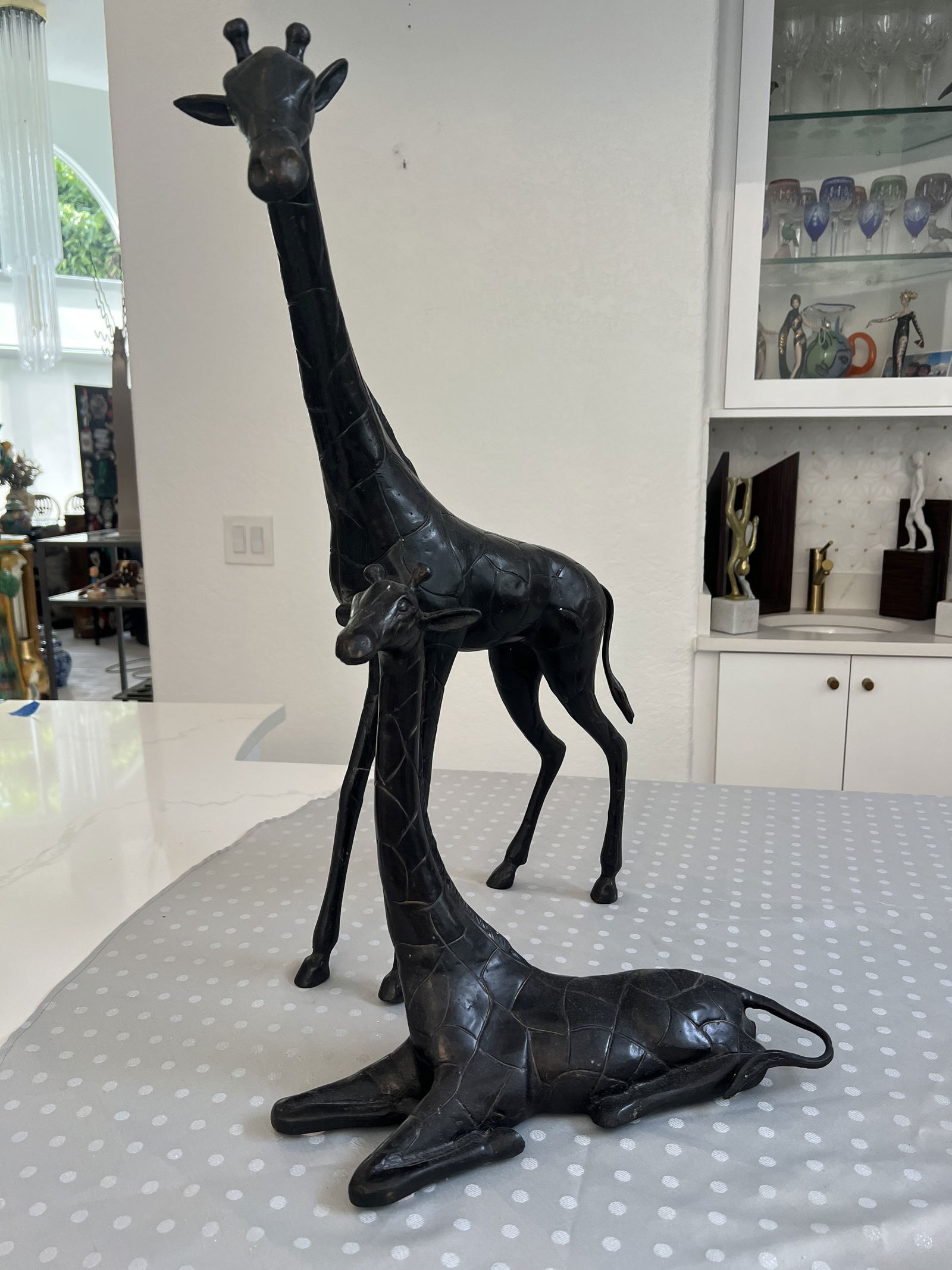 (2) Maitland Smith Style Giraffes: Two giraffes, bronze with patina. Dimensions: Larger: H 26" x L 22" x D 3.5" Condition: Presenting well. Low Estimate: 400.00High Estimate: 650.00