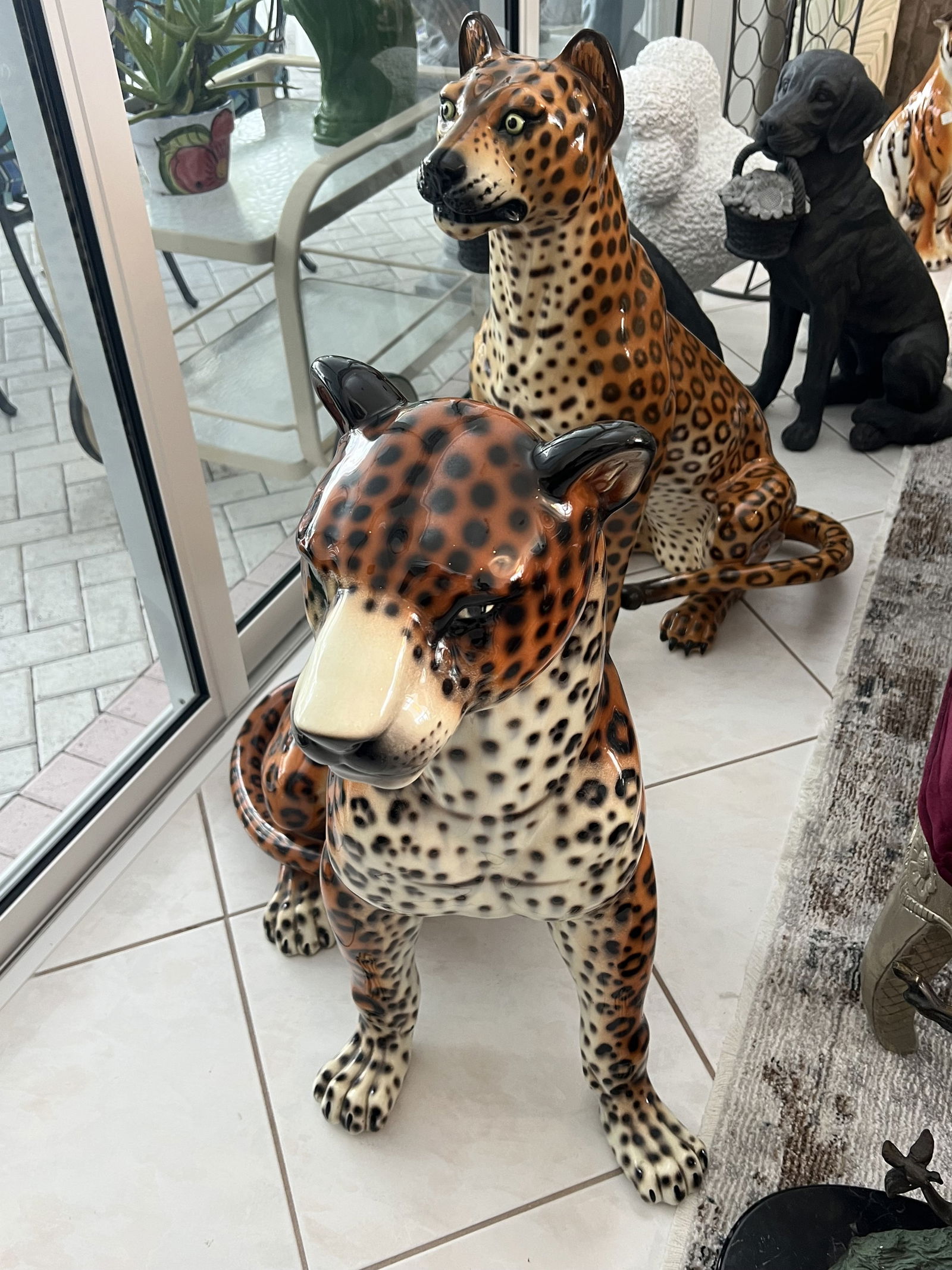 (2) Lifesize Leopard Statues: Lifesize, floor statues leopards or cheetahs, vintage. No markings, likely Italian. Condition: Both with various repairs, incliuding legs and back, sold as is. Dimensions: Larger: H 34" x L 24" x W