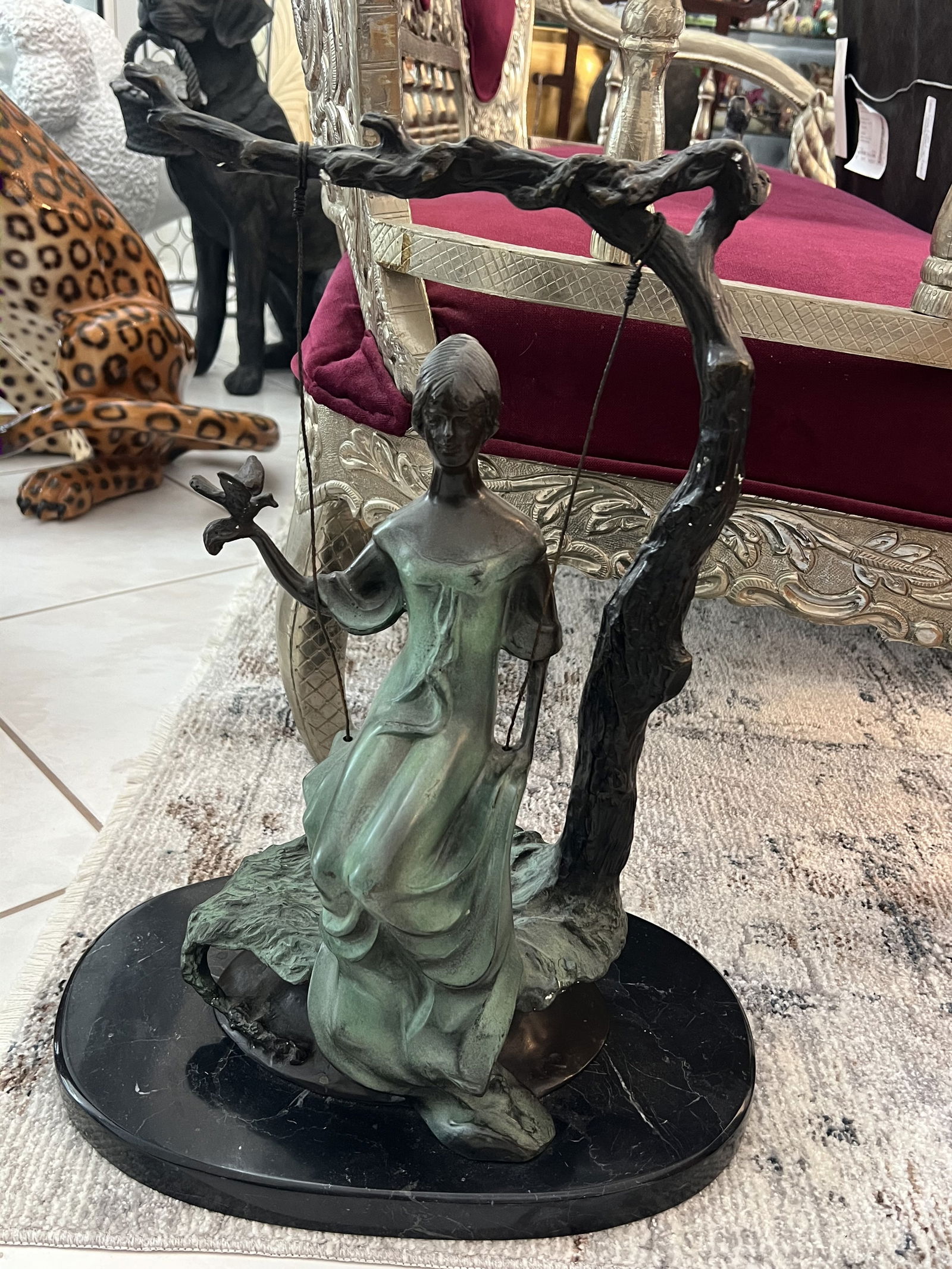 Bronze "The Swing" Statue: After Louis Icart, bronze with patina. Dimensions: H 21" x W 15" x D 9" Condition: Presting nicely, minor white polish. Low Estimate: 1000.00High Estimate: 1500.00