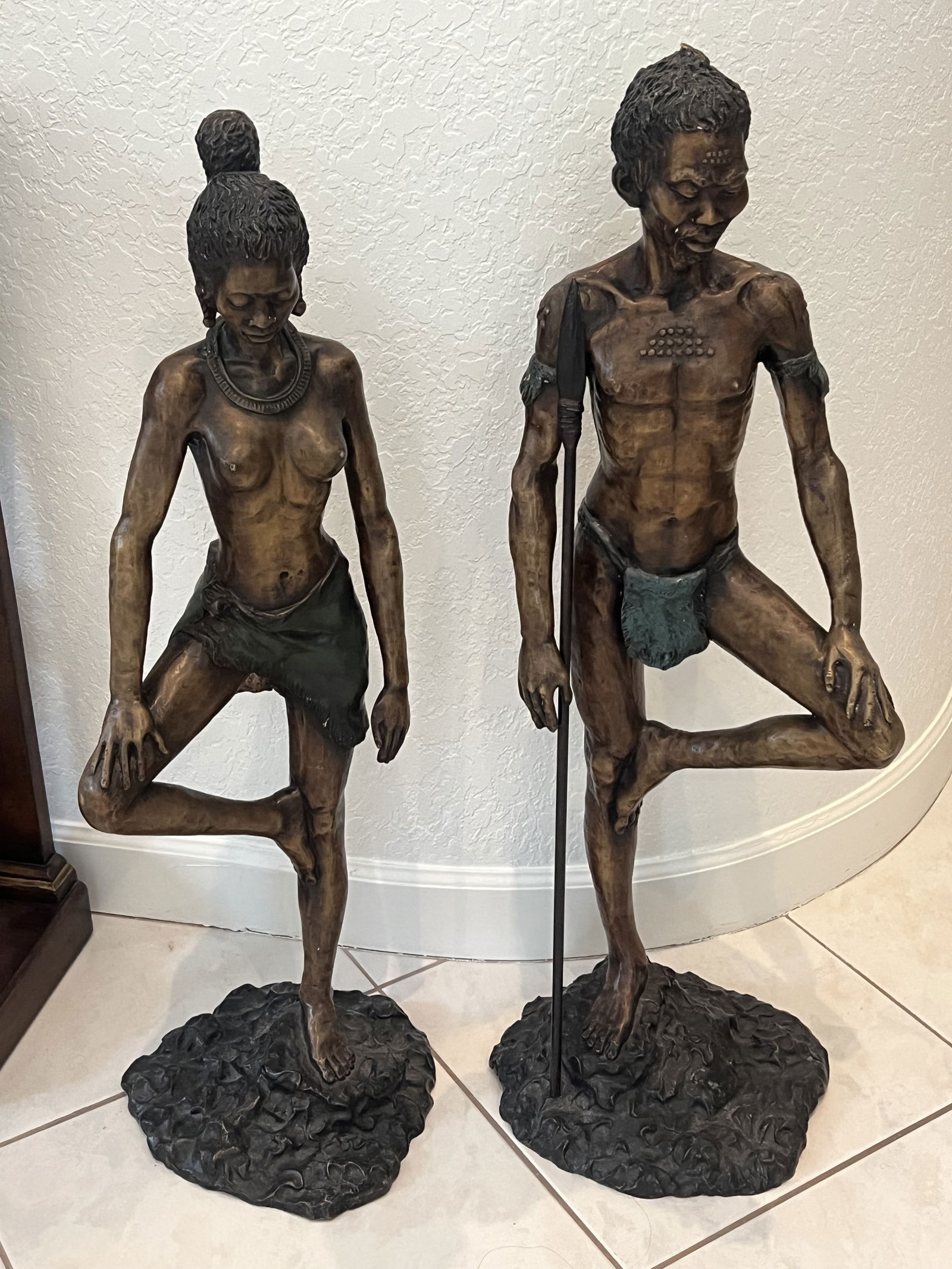Pair of African Warrior Bronze Statues Large 3 Feet Tall: An African bronze pair, female and male warriors. Floor statues measuring H 37" x W 14" x D 12" Condition: presenting well, no issues to note. Low Estimate: 2000.00High Estimate: 4000.00