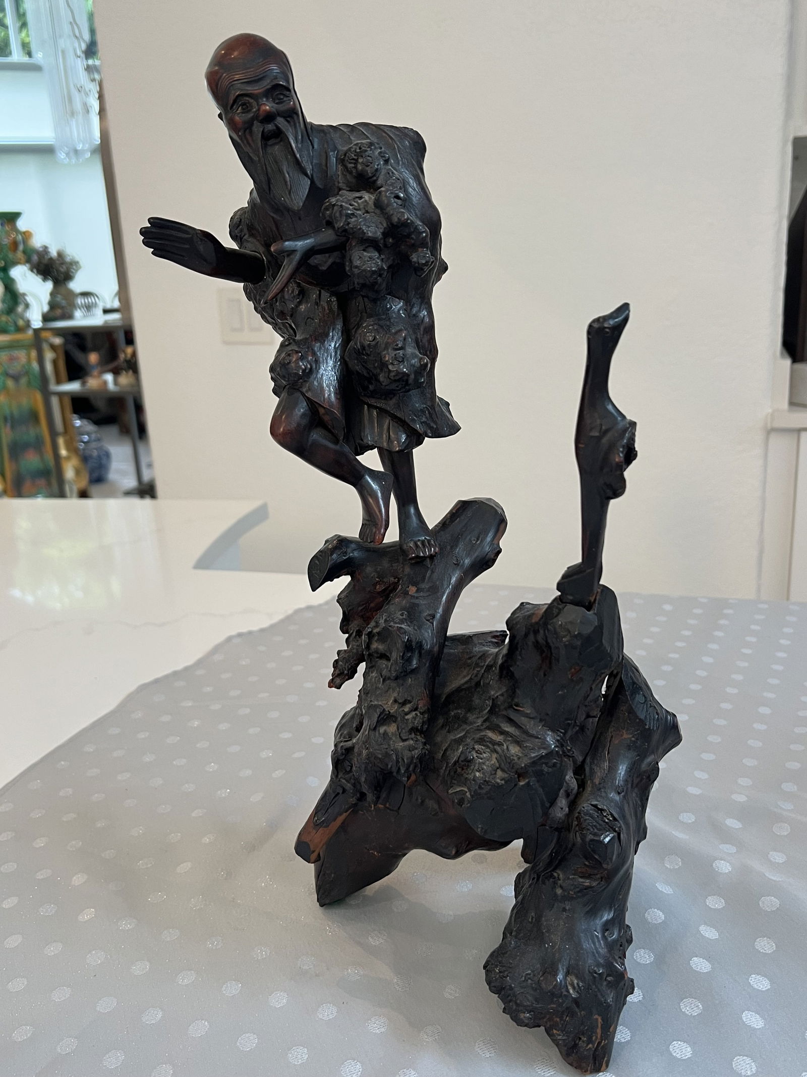 Chinese Rootwood Carving: Rootwood figural carving. Dimensions: H 18.5" x W 9" x D 7" Condition: Minor signs of age, no major losses or repairs, split to head. Low Estimate: 300.00High Estimate: 500.00