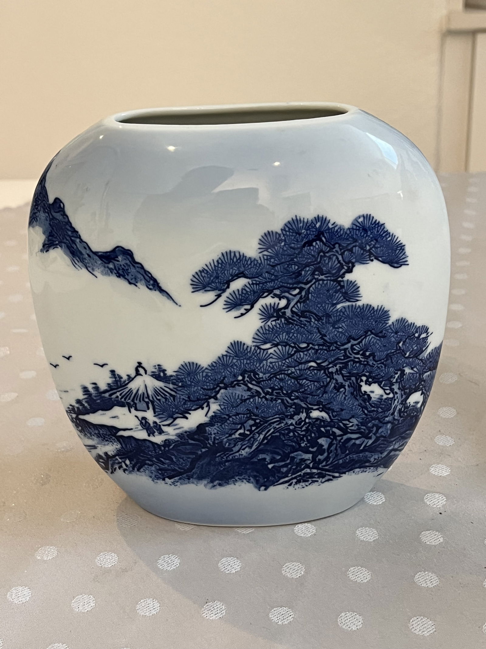 Japanese Blue and White Vase: A signed vintage vase. Dimensions: H 7.5" x W 7" Condition: Presenting well, minor signs of age. Low Estimate: 50.00High Estimate: 150.00