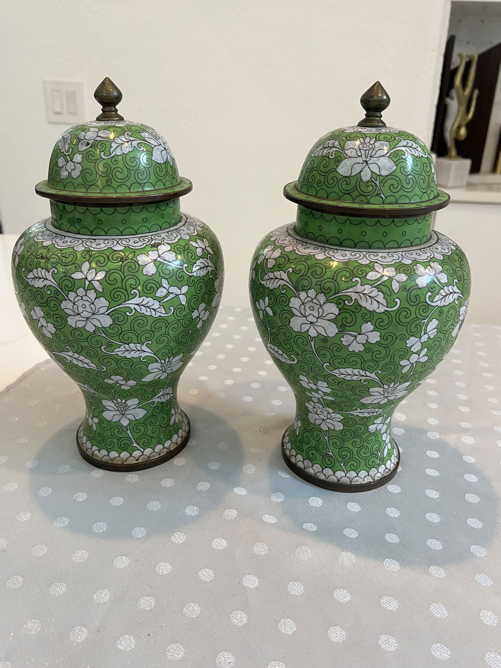 Pair of Green Cloisonne Covered Jars: Chinoserie ginger jars, enamel on copper, vintage China. Dimensions: H 12" x W 6" Condition: Scattered small losses, mostly to one vase. High Estimate: 400Low Estimate: 200