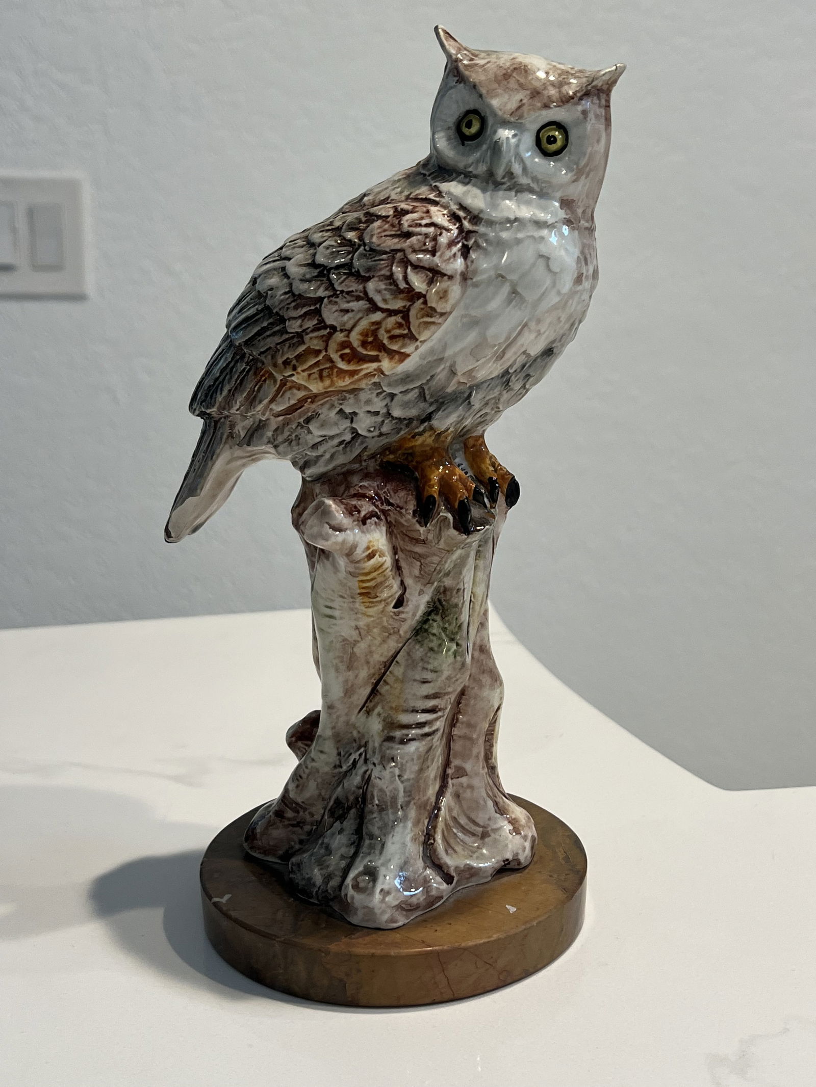 Made in Portugal Horned Owl Figurine: Made in Portugal sticker under, ceramic with marble base. Beautiful details. Dimensions: H 11" x W 6" Condition: Chip to tail. Low Estimate: 50High Estimate: 100