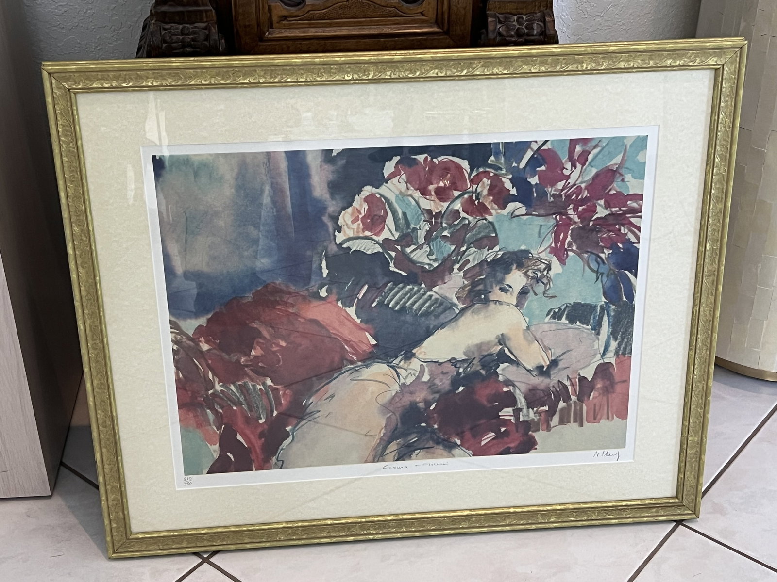 Nitza Flantz "Figure & Flowers": Original, limited edition lithograph, signed and numbered. Gold frame, glass front. Dimensions: Framed: H 24.5" x W 30" Condition: Presenting well. Low Estimate: 200.00 High Estimate: 300.00