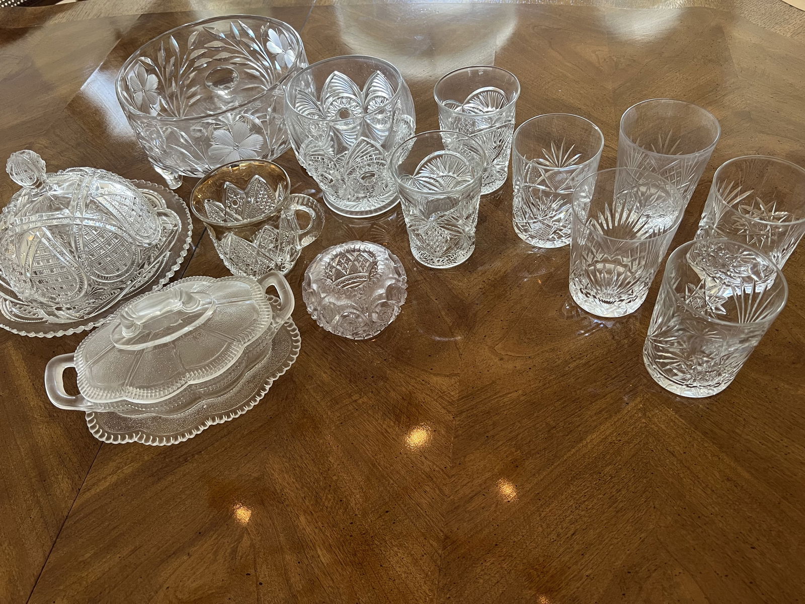 Grouping of Antique Cut and Pressed Glass and Crystal: A lidded cheese dish, a lidded gravy boat, misc lasses and vases and a footed compote. Dimensions: Largest: H 4" x 7.5" Condition: Scattered small chips. Low Estimate: 10.00High Estimate: 10000.00