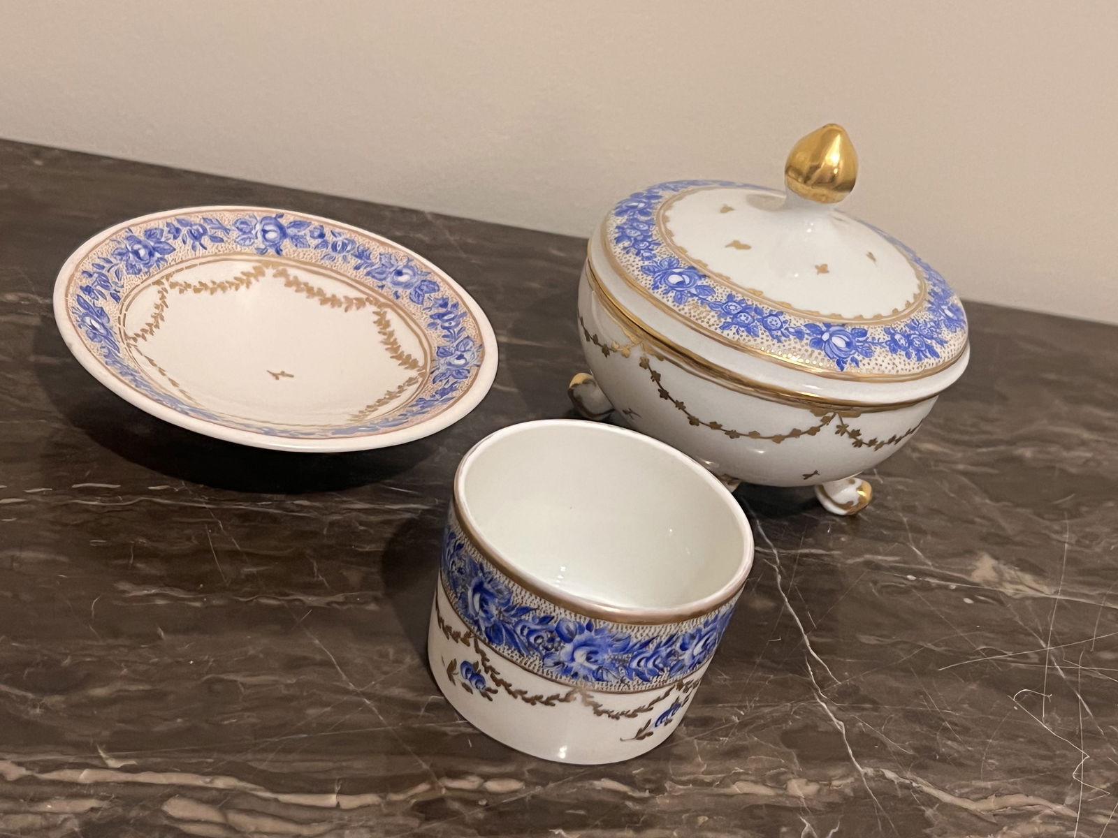Antique European Porcelain Dresser Set: A fine antique blue, white and gold porcelain vanity set including a footed ring dish, a brush pot? and a footed covered bowl. All with marks to bottom. One reads Noel 1930 Franceline, one BN 1932,