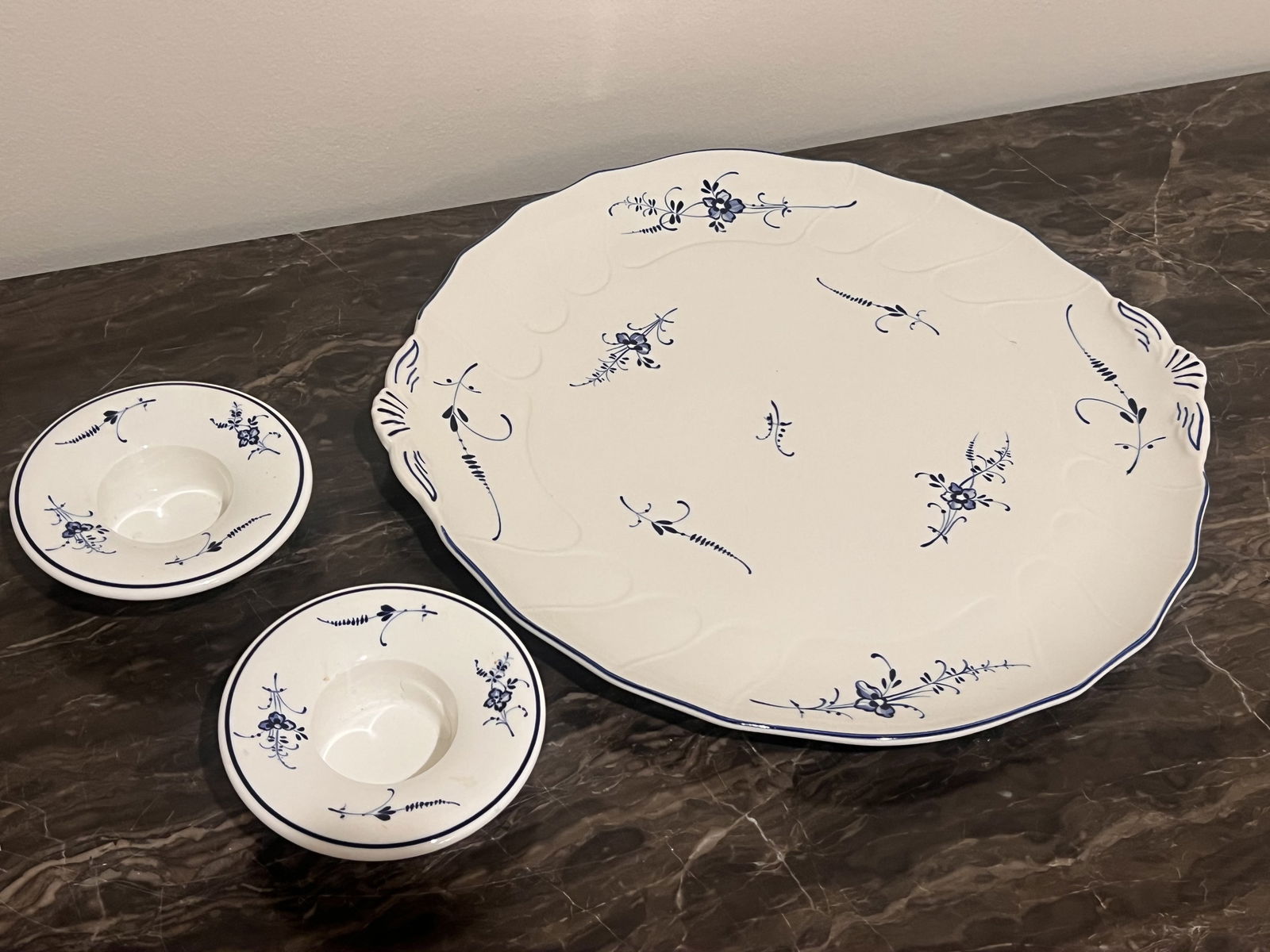 Villeroy & boch Luxembourg Blue and White Grouping: A dessert platter and a pair of candleholders. Dimensions: Plate: Dia: 12.5" Condition: Very minor signs of handling. Low Estimate: 10.00High Estimate: 10000.00