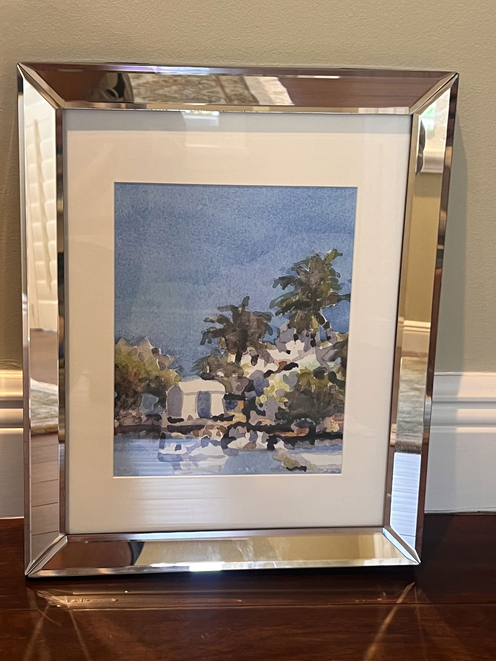 Decorative Coastal Print in Mirrored Frame: A lovely coastal print of an impressionist watercolor painting. Cute mirrored frame. Dimensions: Framed: H 16" x W 13" Low Estimate: 10.00High Estimate: 10000.00