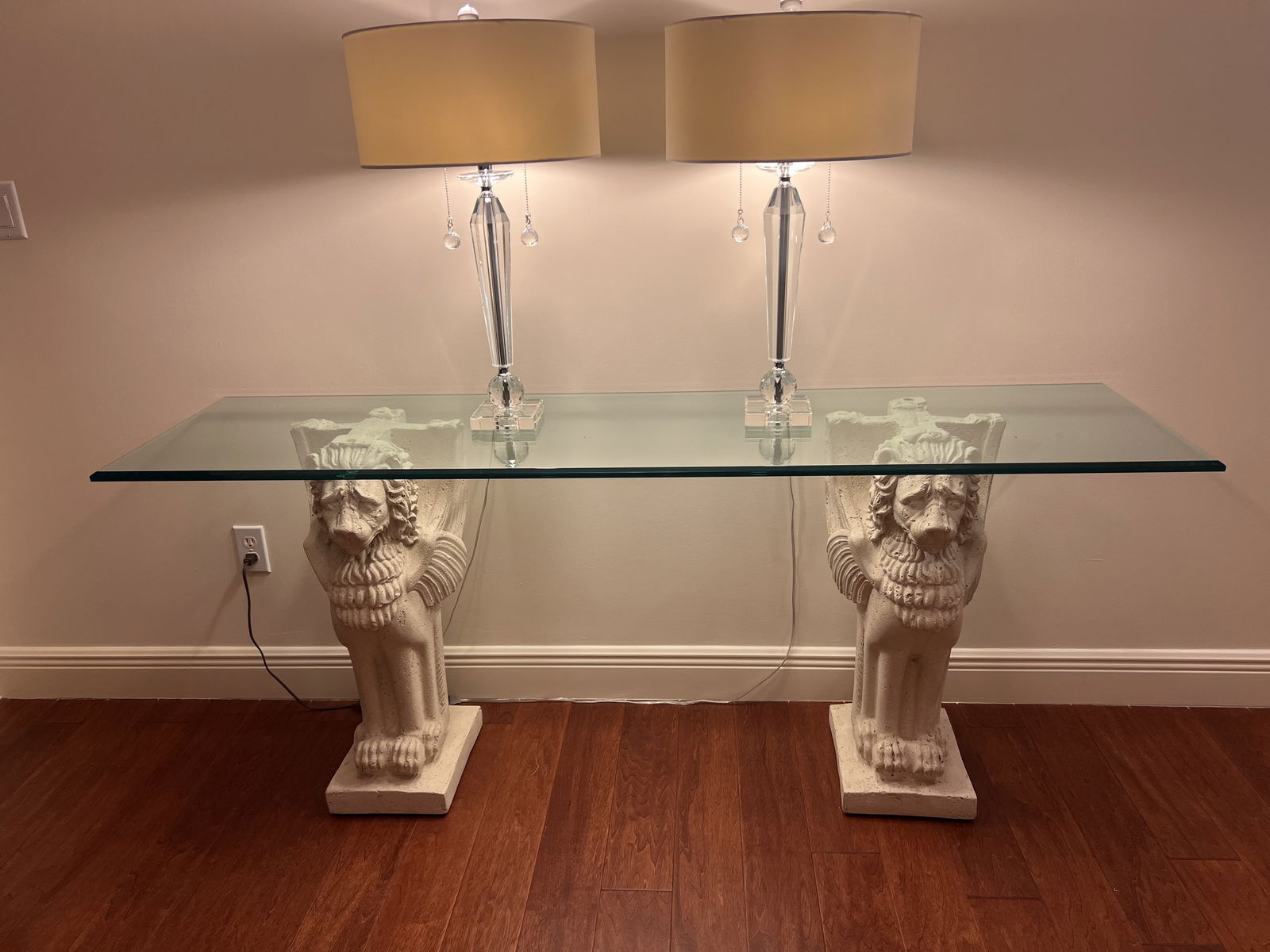 Classic Greek Winged Griffin Console Table: An entry or console table composed to cast stone featuring two classical winged griffens. A nice, thick beveled glass top. Dimensions: H 30" x L 72" x D 19" Condition: Presenting well, only minor