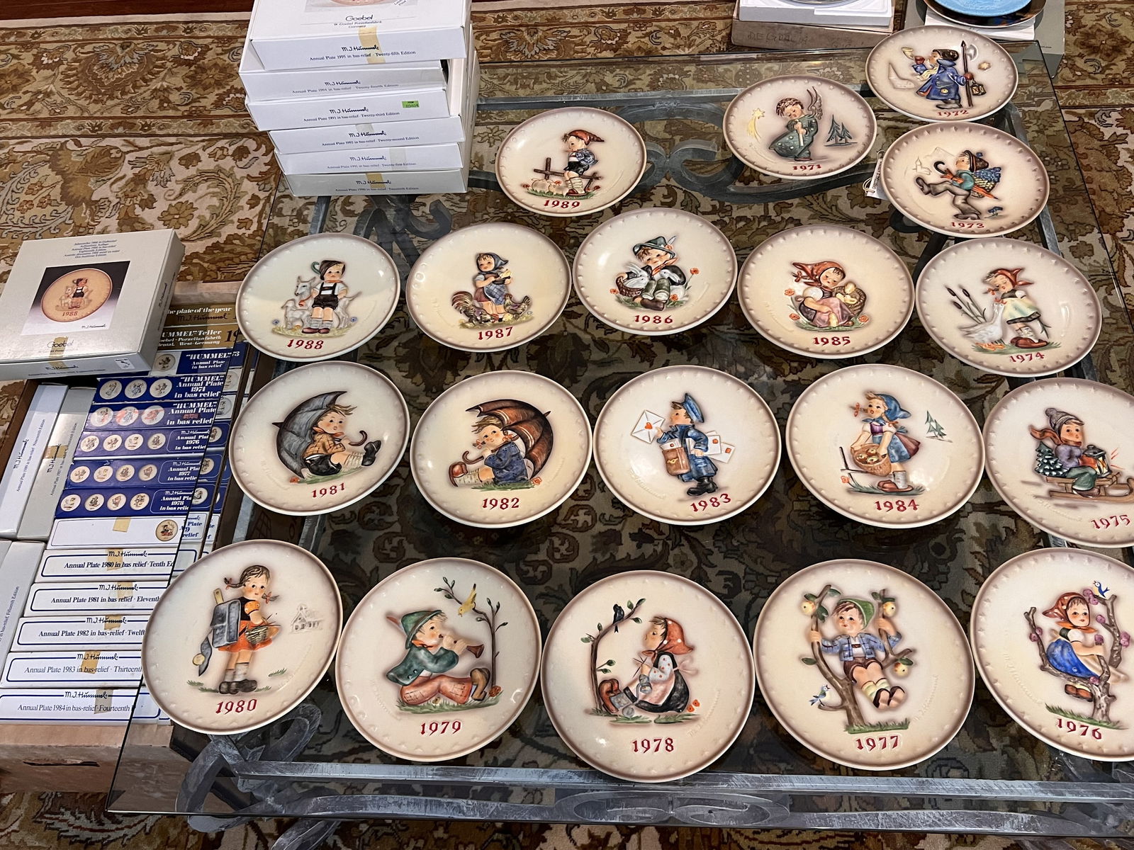 Hummel Collector Plates- 25 Plates and Boxes: A set of 25 Hummel collector plates and their original boxes. Years range from 1971-1995. Condition: No damage, minor signs of age. Low Estimate: 10.00High Estimate: 10000.00