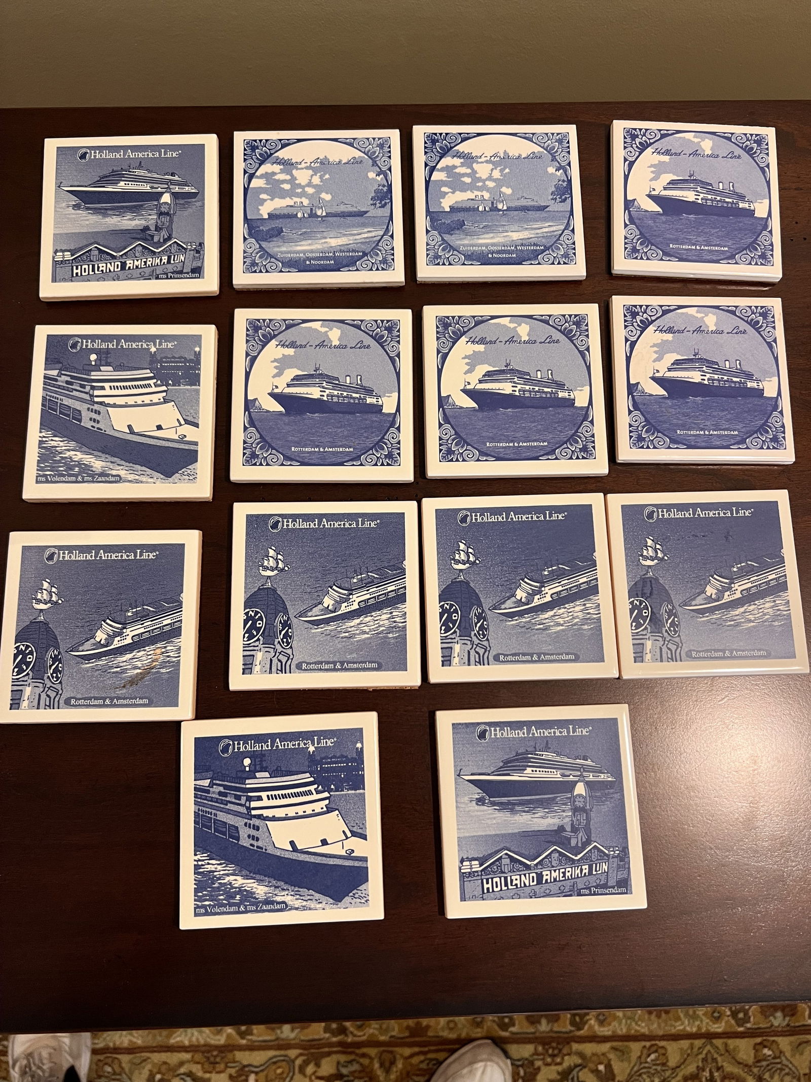 Holland America Line Blue and White Porcelain Tiles: Tile coasters. Dimensions: 4" square. Condition: Very good, used, vintage. Low Estimate: 10.00High Estimate: 10000.00