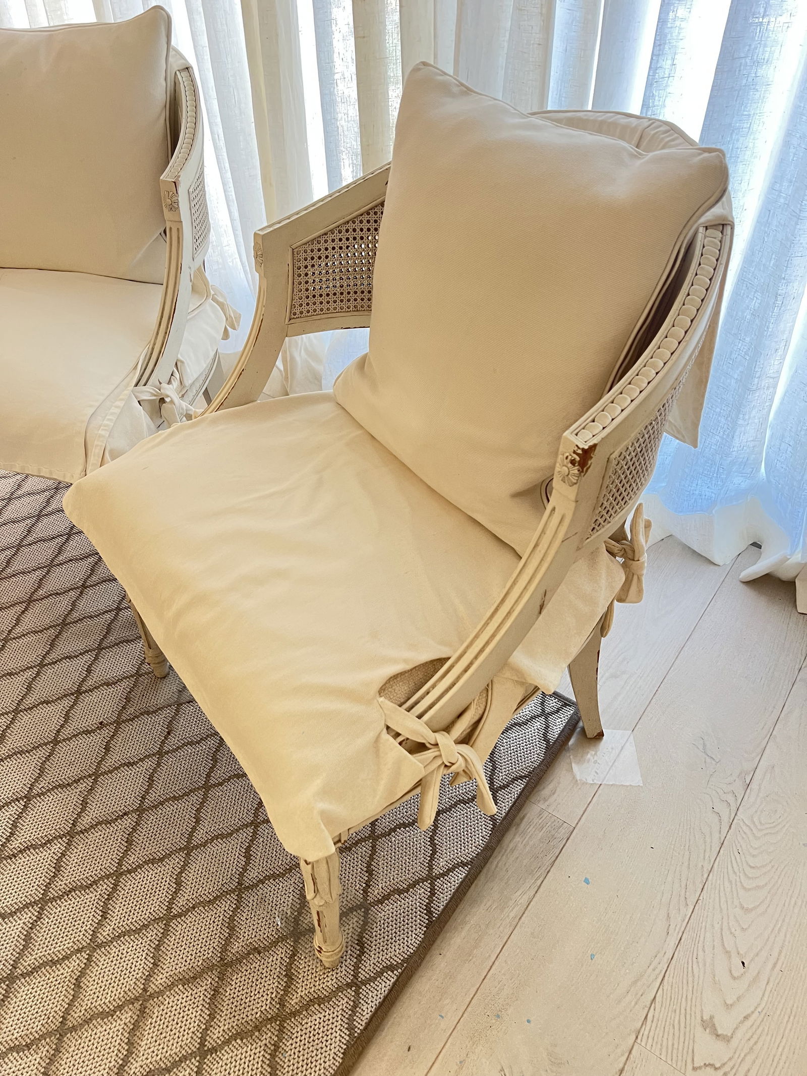 Pair of White Slipcovered French Louis XVI Cane Arm Chairs - 3