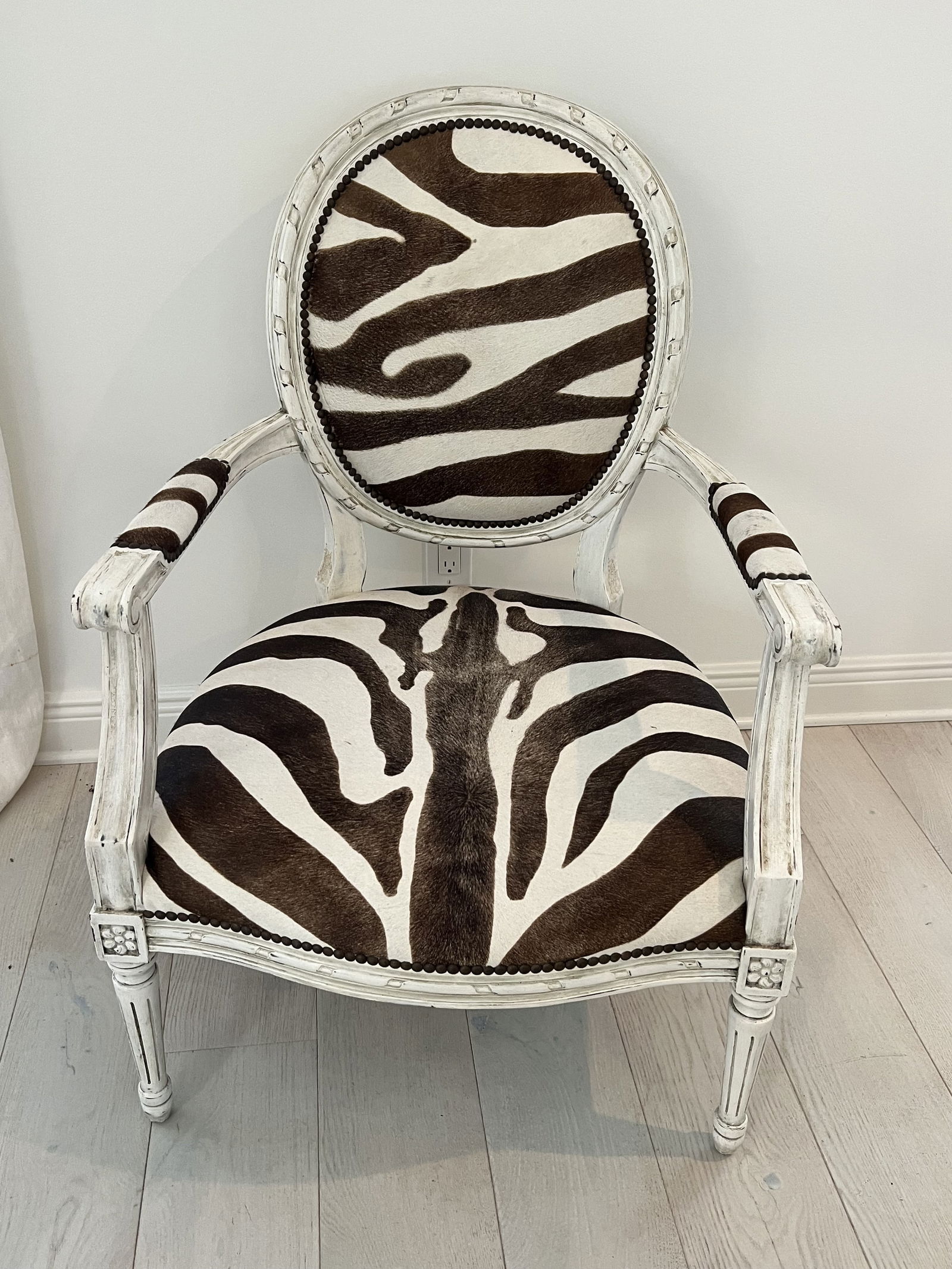 French Style Zebra Armchair by Oly Studios Sophie Chair: Oly Studios designer, zebra print cowhide chair. Dimensions: H 38" x W 26" x D 23" x Seat height: 15" Condition: Presenting well, minor wear to seat. Low Estimate: 10.00High Estimate: 10000.00