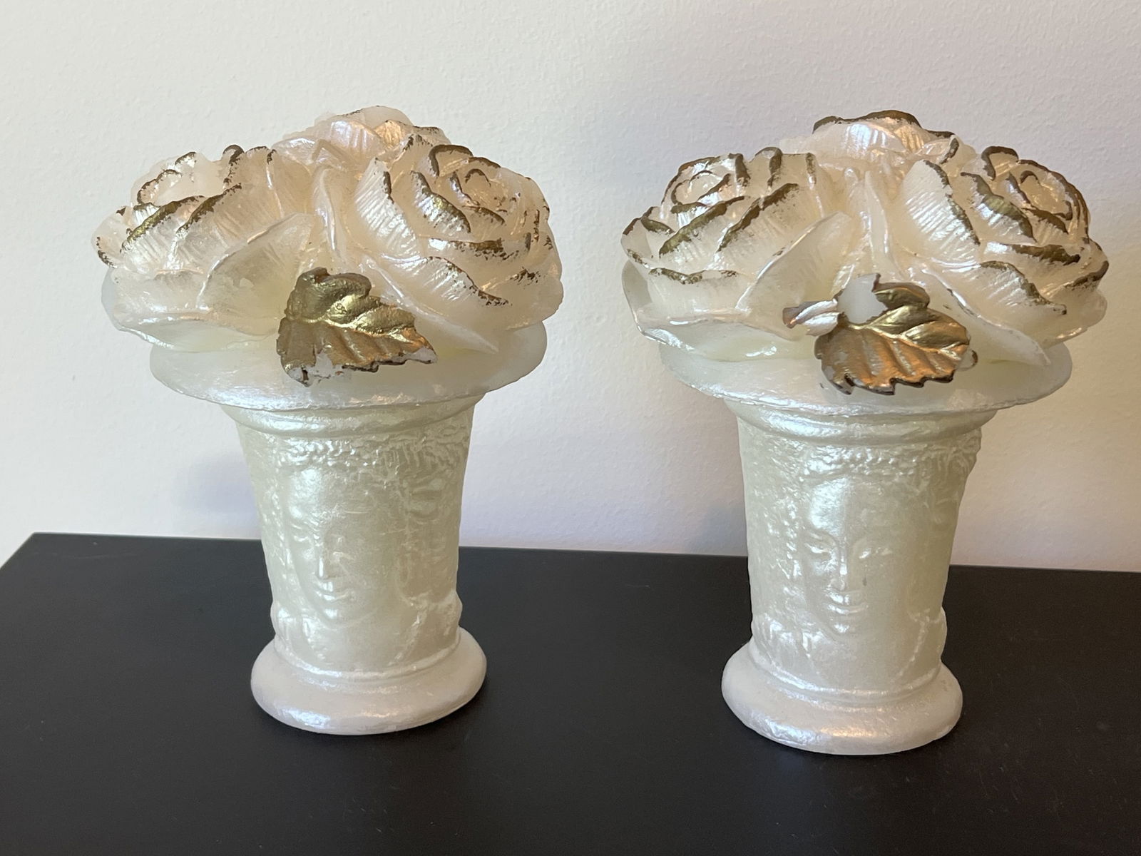 Pair of MMA Rose Bouquet Cameo Candles: A pair of wax candles with cameo vases and rose bouquets. Dimensions: H 6.5" x W 5" Condition: One area of loss. Low Estimate: 10.00High Estimate: 10000.00