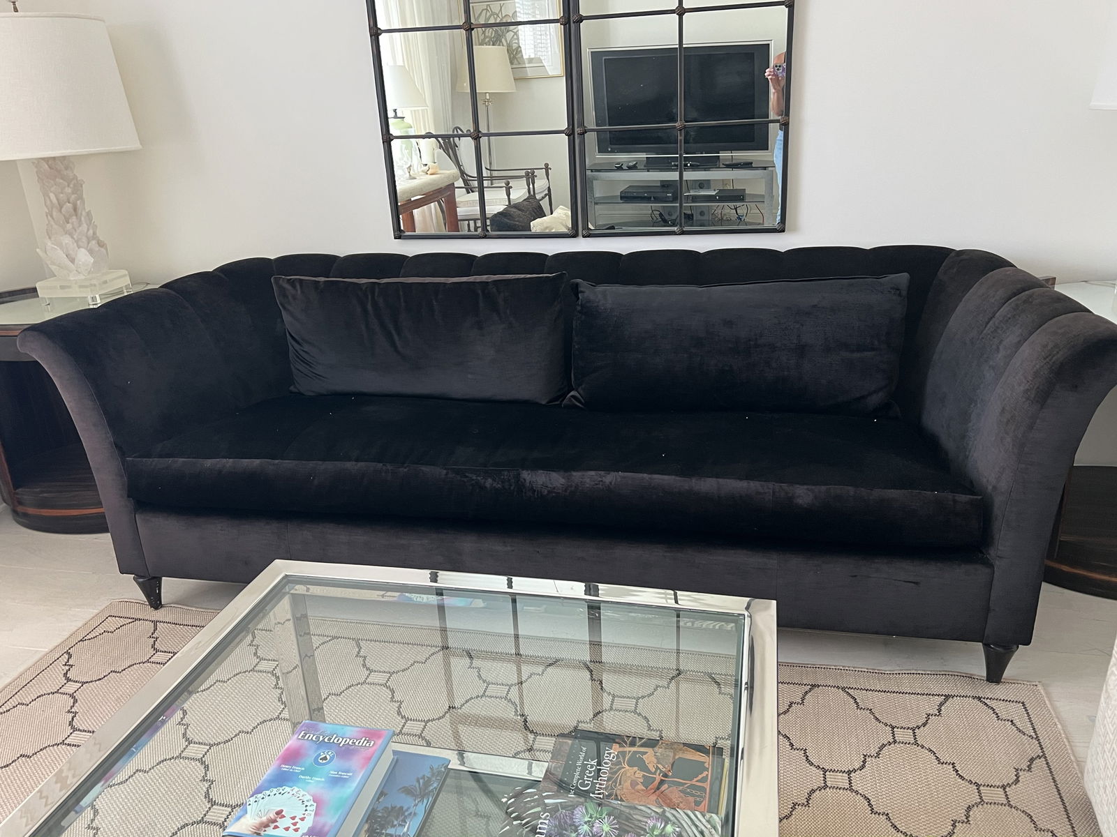 Donghia Black Velvet Upholstered Sofa: A contemporary and sleek black velvet 96" sofa by Donghia. H 30" x L 96" x D 39" x Seat height: 19" Condition: Lightly used, no damage, minor dust. Low Estimate: 10.00High Estimate: 10000.00