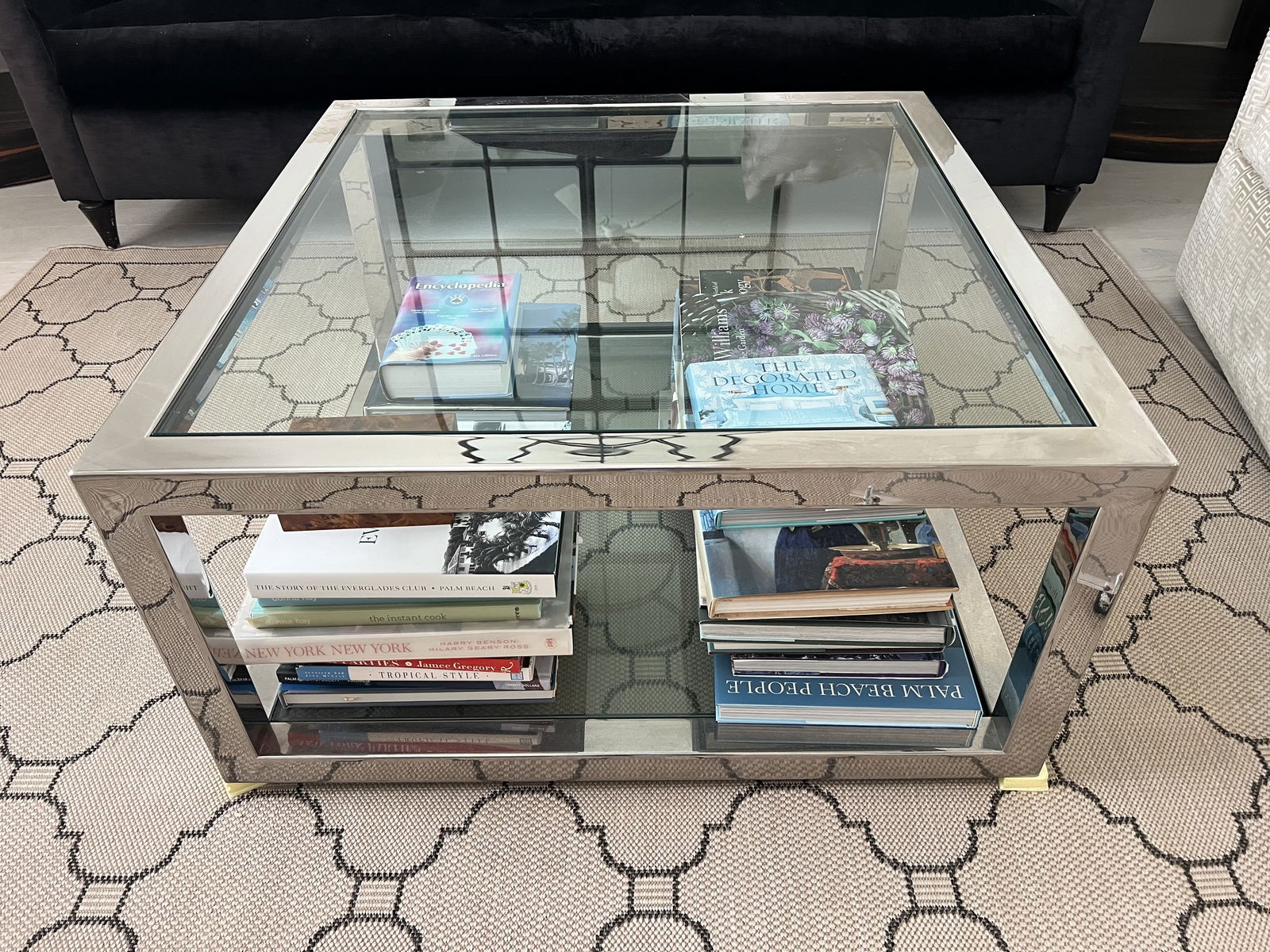 36" Square Chrome and Glass Coffee Table: Likely J Robert Scott. Tubular square contemporary minimalist coffee table in silver tones or chrome with glass top. Maker unknown. Dimensions: H 18" x W 36" square Condition: Very good. Low Estimate