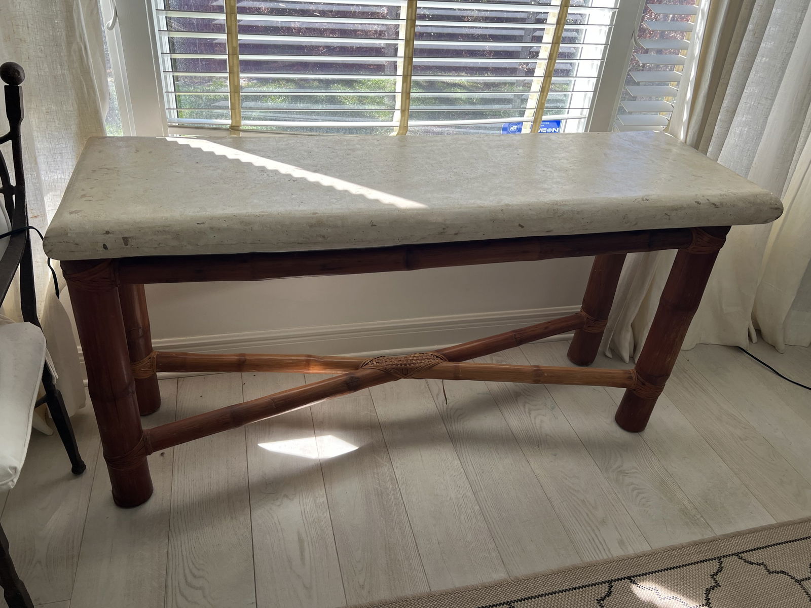 Bamboo and Travertine Console or Sofa Table: A vintage elephant bamboo with leather cord and travertine top. Dimensions: H 29" x L 60" x D 19" Condition: Showing minor signs of age and use including scuffs to corners, no breaks or repairs. Low