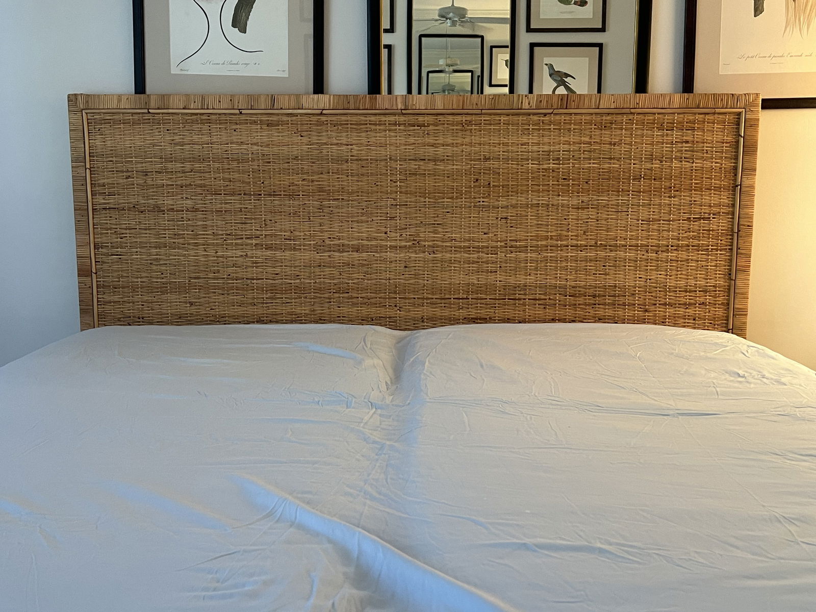 Rattan and Bamboo Headboard Full Size: Full Size, newish with label from 2025. Dimensions: W 79" (overall) Bolt hole to bolt hole: 74" x H 50" x D 2" Condition: No issues to note. Low Estimate: 10.00High Estimate: 10000.00