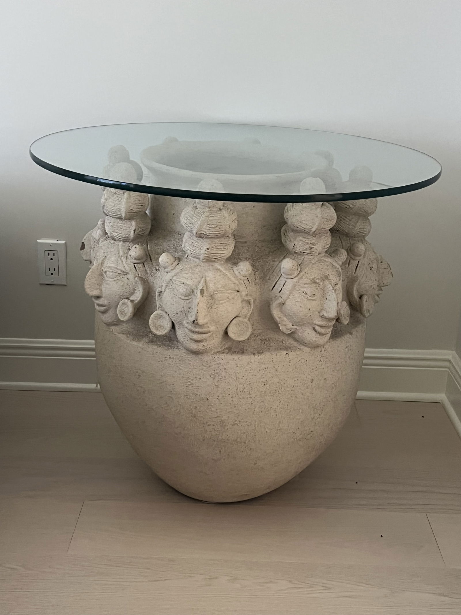 Large Pre-Columbian Style Mayan or Mesoamerican Face Planter: A pottery urn or planter with many faces in the Mayan style. Currently staged an an end table, it comes with a glass top. (Glass: Dia: 30.25" x W 0.50") Dimensions: Vessel only: H 26" x Dia: 26"