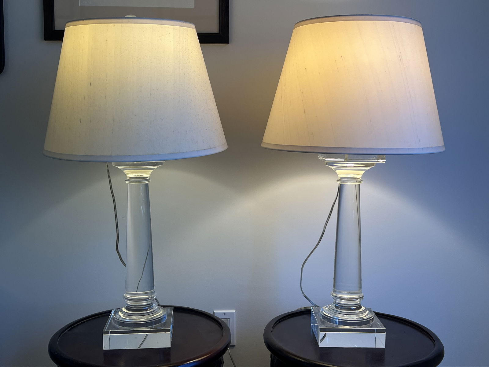 Pair of Restoration Hardware Saxon Table Lamps: Solid glass crystal columns in classic form. Lovely White shades and brass hardware. Dimensions: H 31" x W 6.5" x D 6.5" Condition: Very good, minor tarnish to brass hardware. Low Estimate: 10.00 Hig