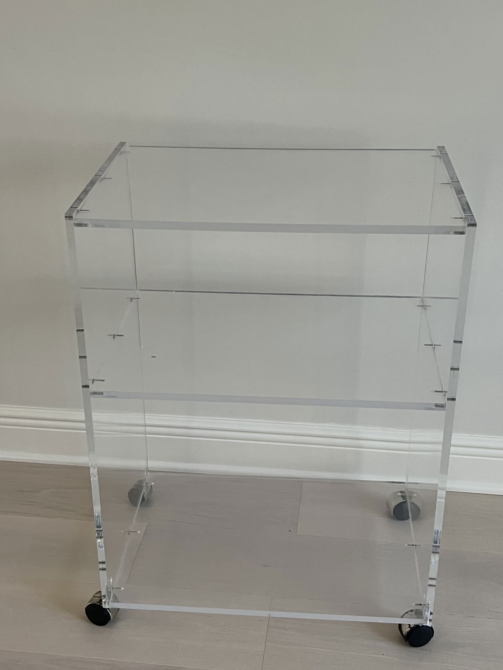 Mid-Century Lucite Bar Cart: Acrylic or lucite, rolling trolley or cart. Dimensions: H 30" x W 22" x D 15" Condition: Wheels need some attention, sturdy some of the wheels don't roll that easily. Otherwise, nice vintage condition