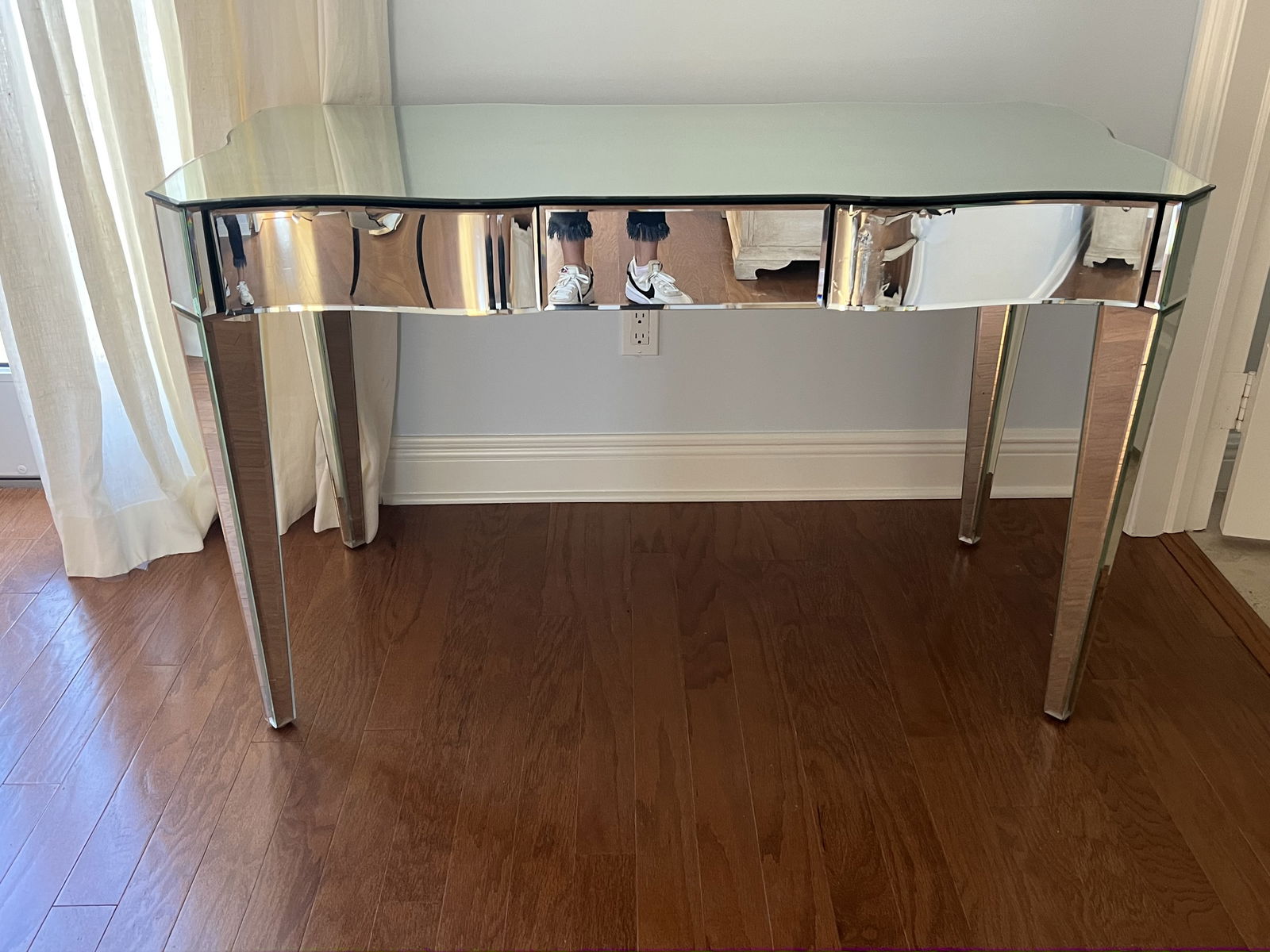 Mirrored Desk: Contemporary desk, manufacturer unknown. Dimensions: H 30" x W 48.5" x D 24" Condition: Drawers with some delamination of silver backing to mirror. No breaks. Low Estimate: 10.00High Estimate: