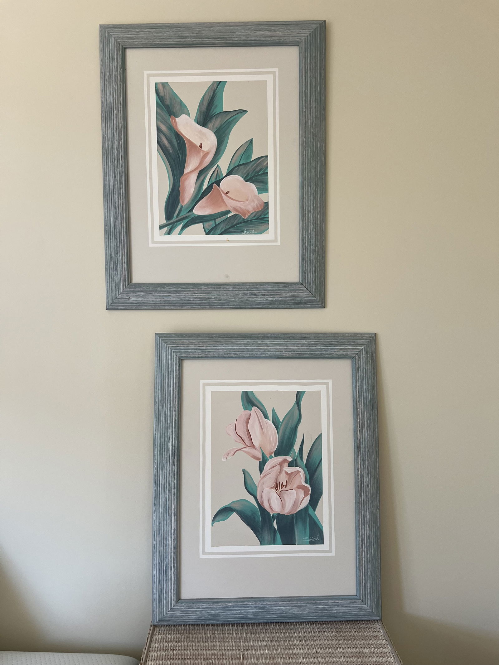 Pair of Florida Style Floral Paintings: Original oil on canvas paintings of a tulip and lily, signed Sarah. In Florida style blue coastal vintage frames. Dimensions: H 29" x W 23" Condition: Presenting well. Low Estimate: 10.00 High Estima
