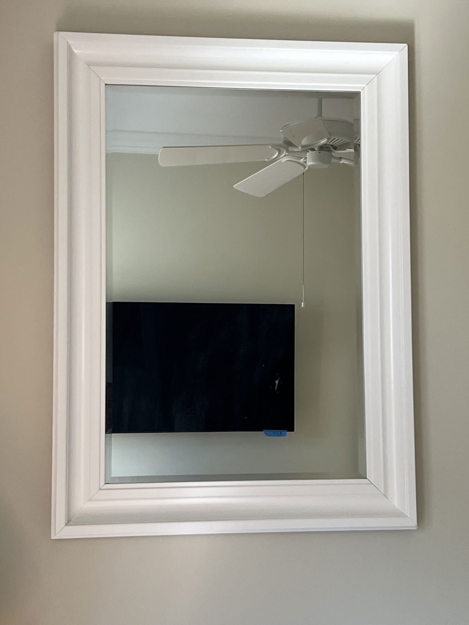 Large White Lacquer Mirror: A large and chunky white lacquer wood mirror with bevel. Dimensions: H 45" x W 35" x D 2.5" Condition: Clean, no issues to note. Low Estimate: 10.00High Estimate: 10000.00