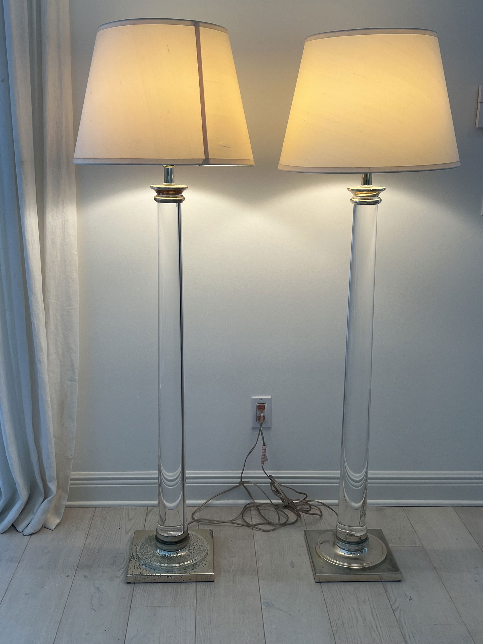 Pair of Restoration Hardware Cylindrical Column Floor Lamps: Acrylic and brass, three way lights, they give off a great light. Dimensions: H 60" x W 10" square Low Estimate: 10.00High Estimate: 10000.00
