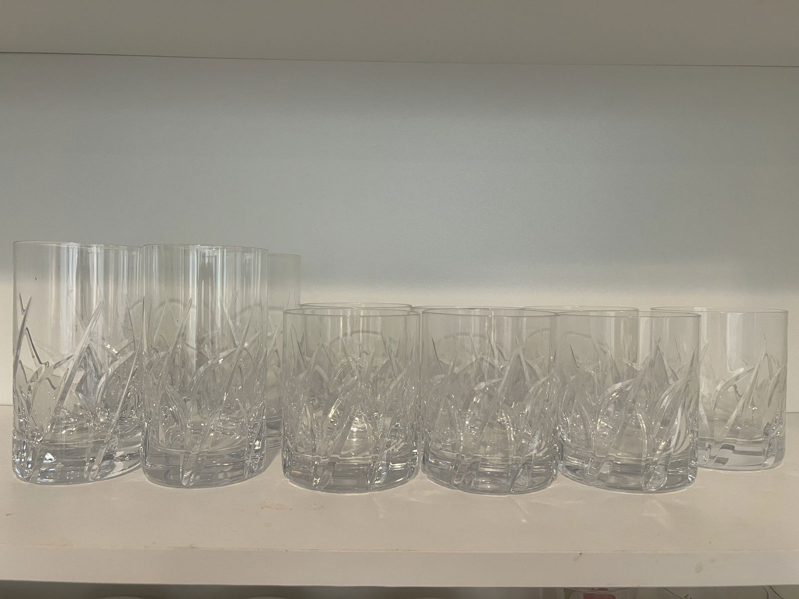 Grouping of Crystal Glasses: Vintage Grosetto by Da Vinci, Italy. 4 Tall drink glasses and 8 high ball glasses (one was not included in the pictures). Dimensions: H 5.5" x Dia: 3" Condition: Very good, no cracks or chips. Low Es