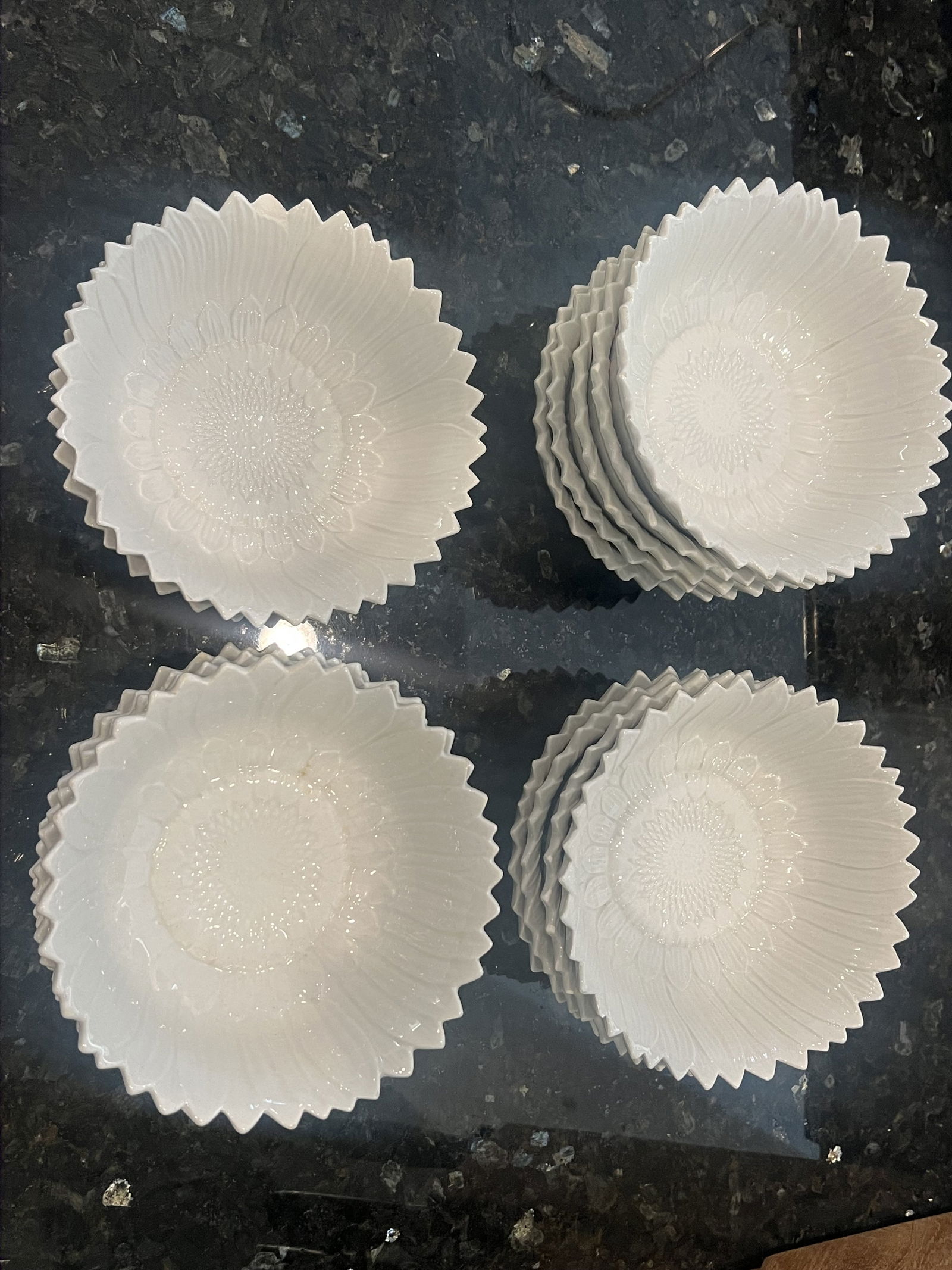 (14) Made in Italy Sunflower Porcelain Bowls: Differing marks under, all similiar in style and size. Dimensions: H 2" x Dia: 6.5" Condition: Four with noticable chips, otherwise only scattered small edge chips. Low Estimate: 10.00High