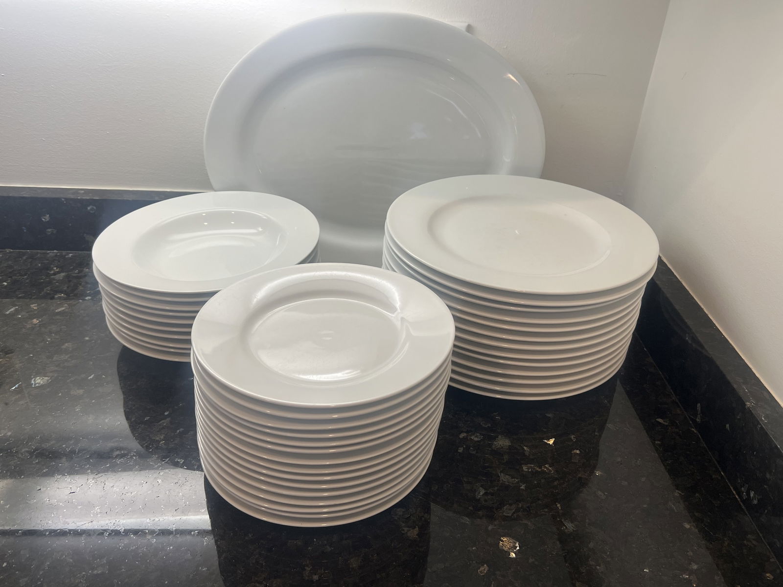 Everday White Plates: Some marked Fitz & Floyd. 15 8" dessert plates, 13 11" dinner plates, a large serving platter (16" x 12.5") and 10 9" soup bowls. Condition: Used, some knife marks, two dessert plates with chips. Low