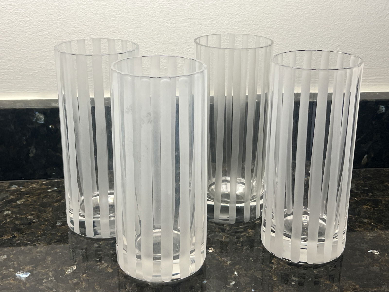MMA UPM Etched Lines Highball Classes: Dimensions: H 6.25" x Dia: 2.75" Condition: One is slightly cloudy, one has a very small rub. Low Estimate: 10.00High Estimate: 10000.00