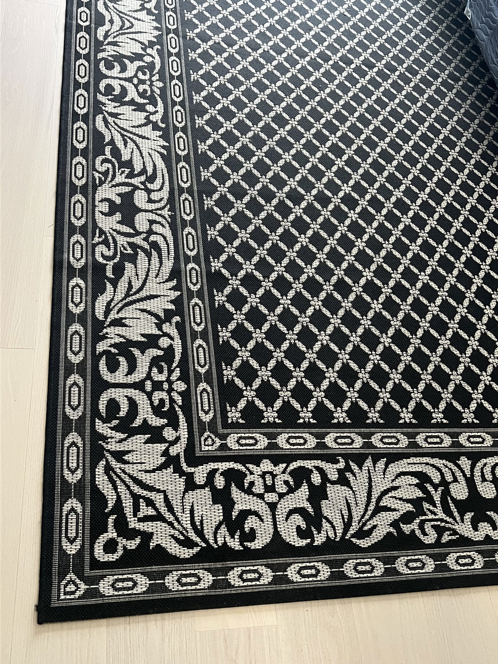 Indoor Outdoor Rug Black: Frontgate, black. Dimensions: 8'6" X 13' Condition: Lightly used, presenting well Low Estimate: 10.00High Estimate: 10000.00