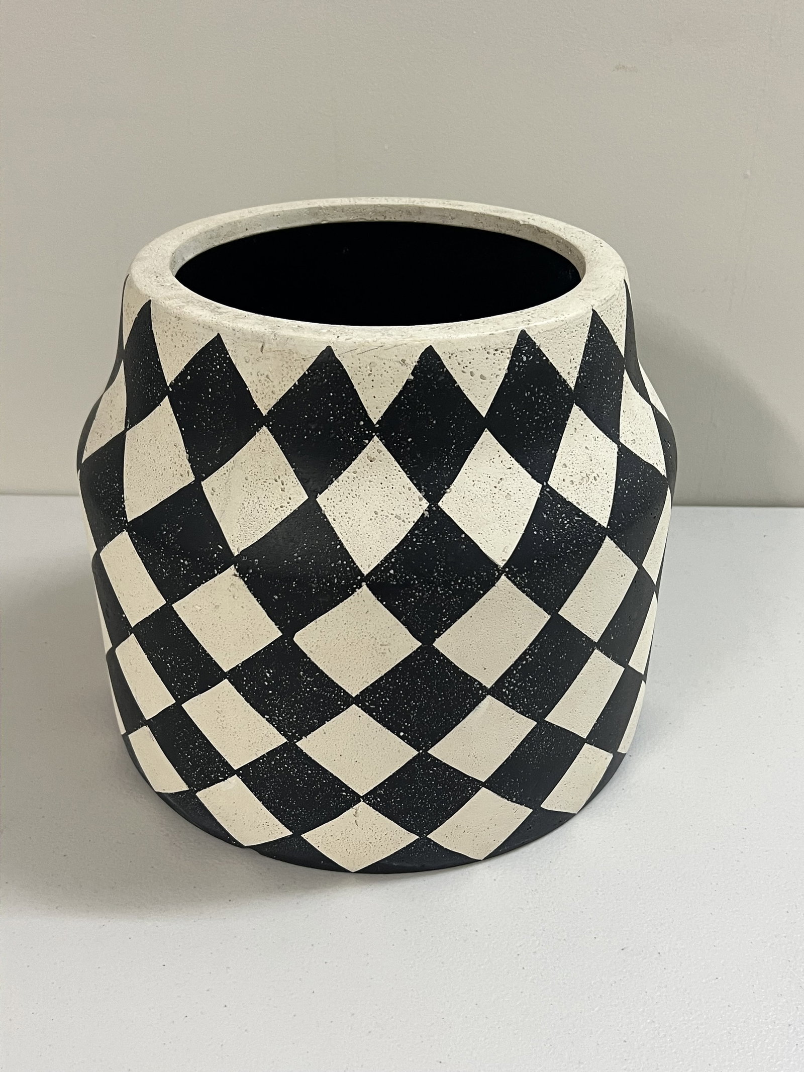 Black and White Harlequin Planter Pot: Grandin Road, outdoor plastic planter pot. Dimensions: H 11.25" x Dia: 12" Condition: Minor use. Low Estimate: 10.00 High Estimate: 10000.00