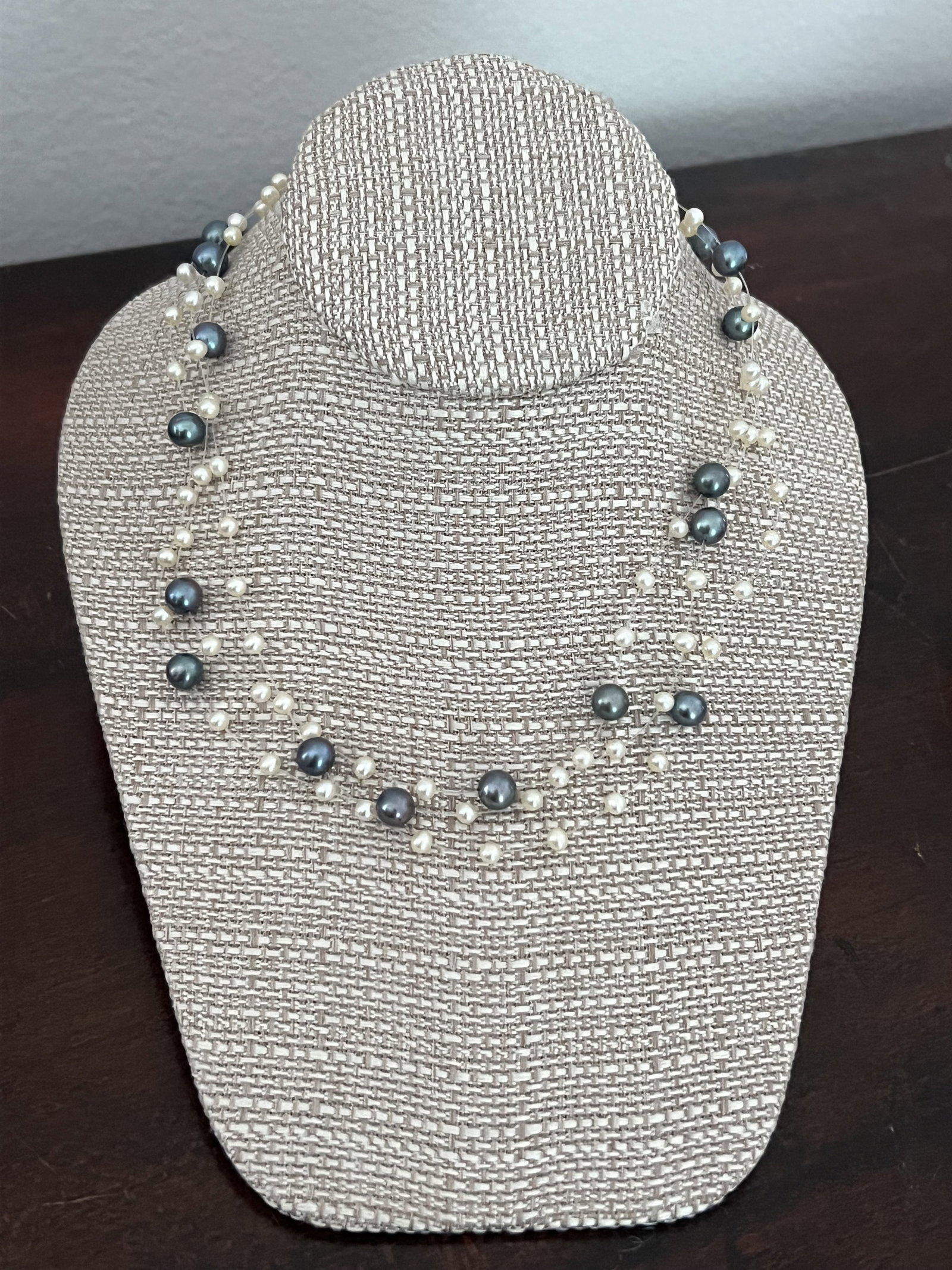Three Strand Pearl Illusion Necklace: Three strand pearl illusion necklace, 14k yellow gold clasp. Dimensions: 16" Weight: 24g Condition: Very good. Low Estimate: 10.00 High Estimate: 10000.00