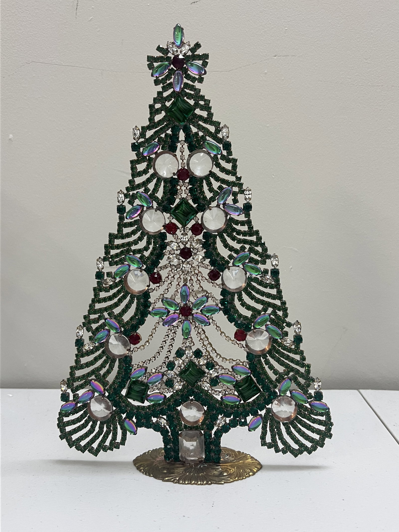 Vintage Czech Rhinestone Crystal Christmas Tree: A large size tree measuring 12" x 8". Amazing large faceted crystals, peakcock color stones and draping swag. Condition: Very good. Low Estimate: 10.00 High Estimate: 10000.00