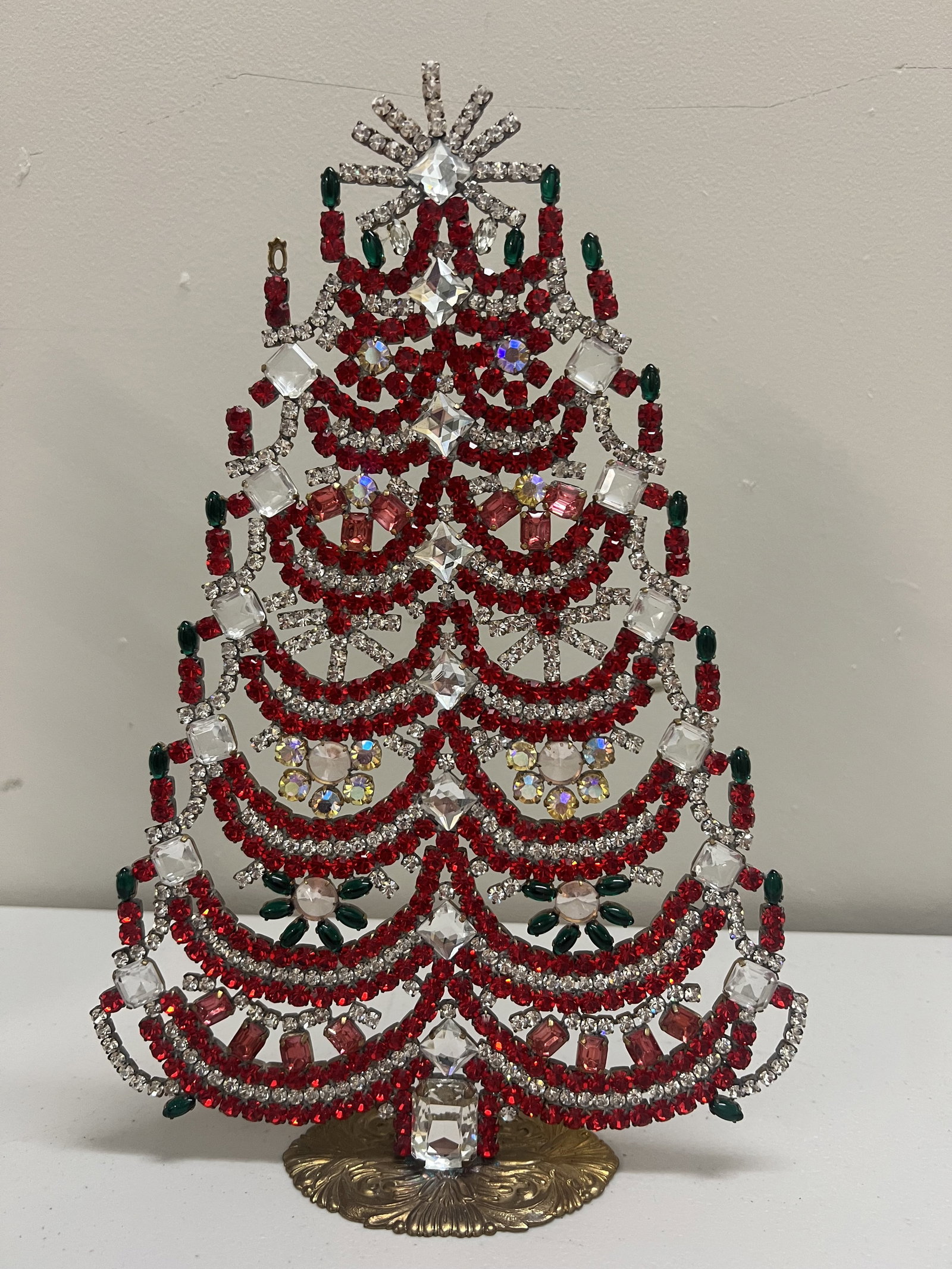 Vintage Czech Rhinestone Crystal Christmas Tree: A large size, mostly red and white tree measuring 12" x 8". Condition: One small stone missing. Low Estimate: 10.00 High Estimate: 10000.00