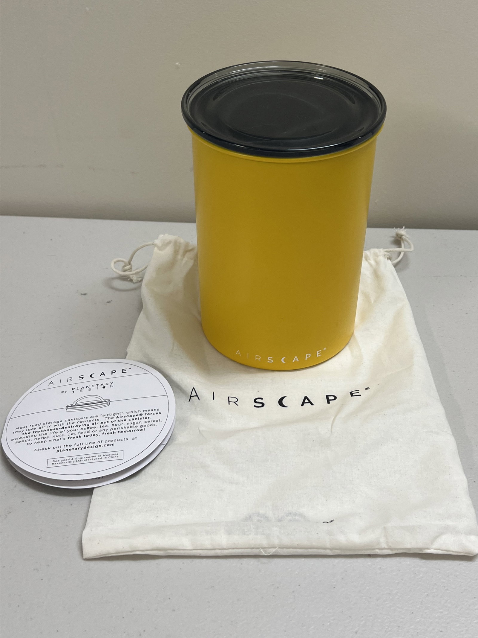 Airscape Coffee Canister Yellow: Stainless steel by Planetary Design. Airscape airtight canister for coffee. Dimensions: H 7" x Dia: 5" Condition: Lightly used. Low Estimate: 10.00 High Estimate: 10000.00