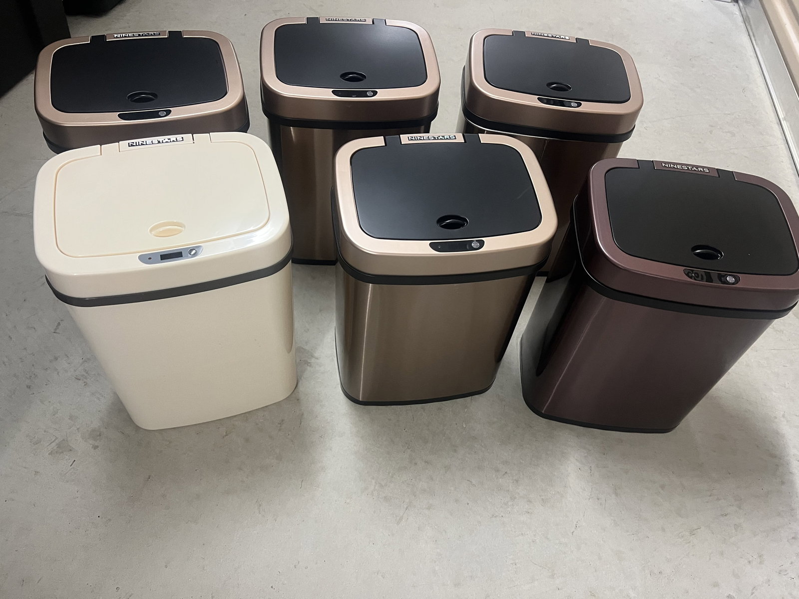 (6) Ninestars Sensor Automatic Trash Cans: Metal in lovely neutral tones. Great condition, lightly used. Dimensions: H 14" x W 10" Low Estimate: 10.00 High Estimate: 10000.00